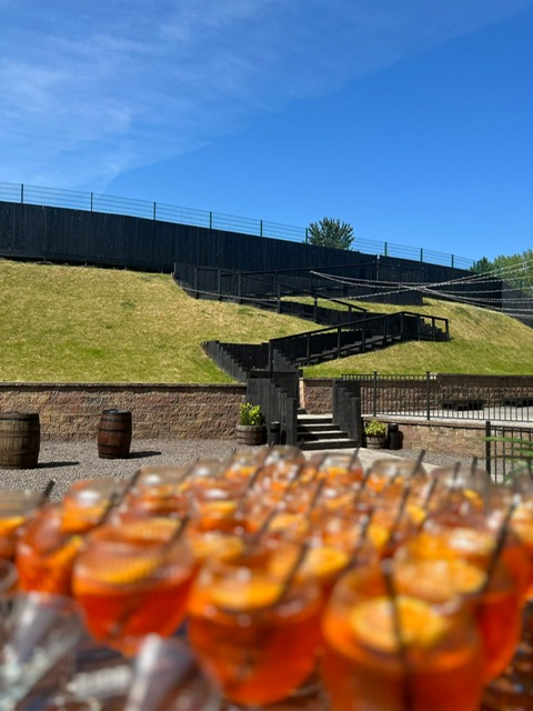 Exclusive Use outdoor venue with tiered landscaping, ideal for events and receptions.