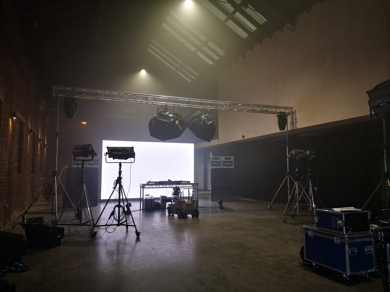 Versatile event space in The Engine Works with professional lighting for concerts and corporate events.
