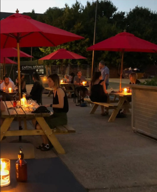 Outdoor dining setup at Renegade Urban Winery for casual networking events.