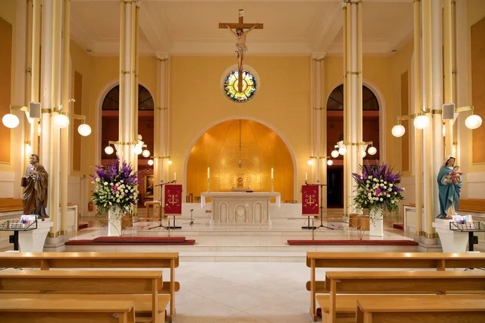 Elegant church meeting room with altar, perfect for weddings and ceremonies.