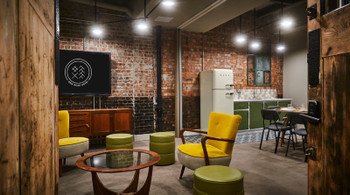 Stylish meeting space with modern furniture for creative workshops at New Road Hotel.