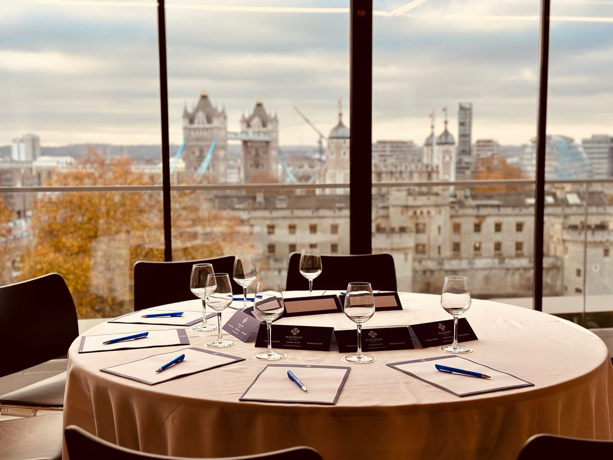 Meeting setup with round table and Tower Bridge view in The Skyline London event space