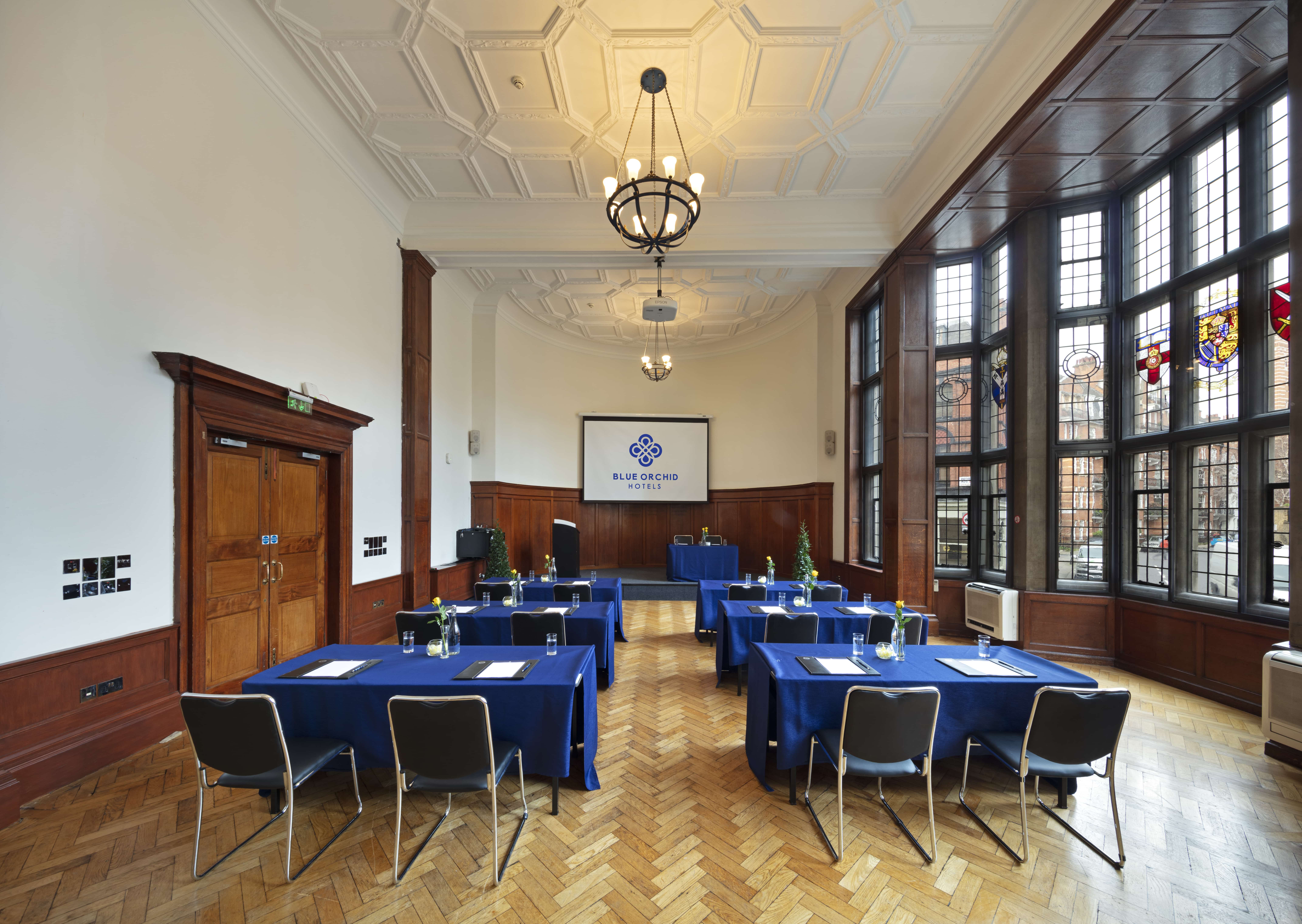 Wellington Suite meeting room with wood paneling, ideal for workshops and presentations.