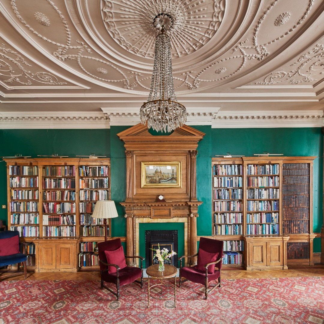 Elegant library meeting space with woodwork, ideal for workshops and gatherings.