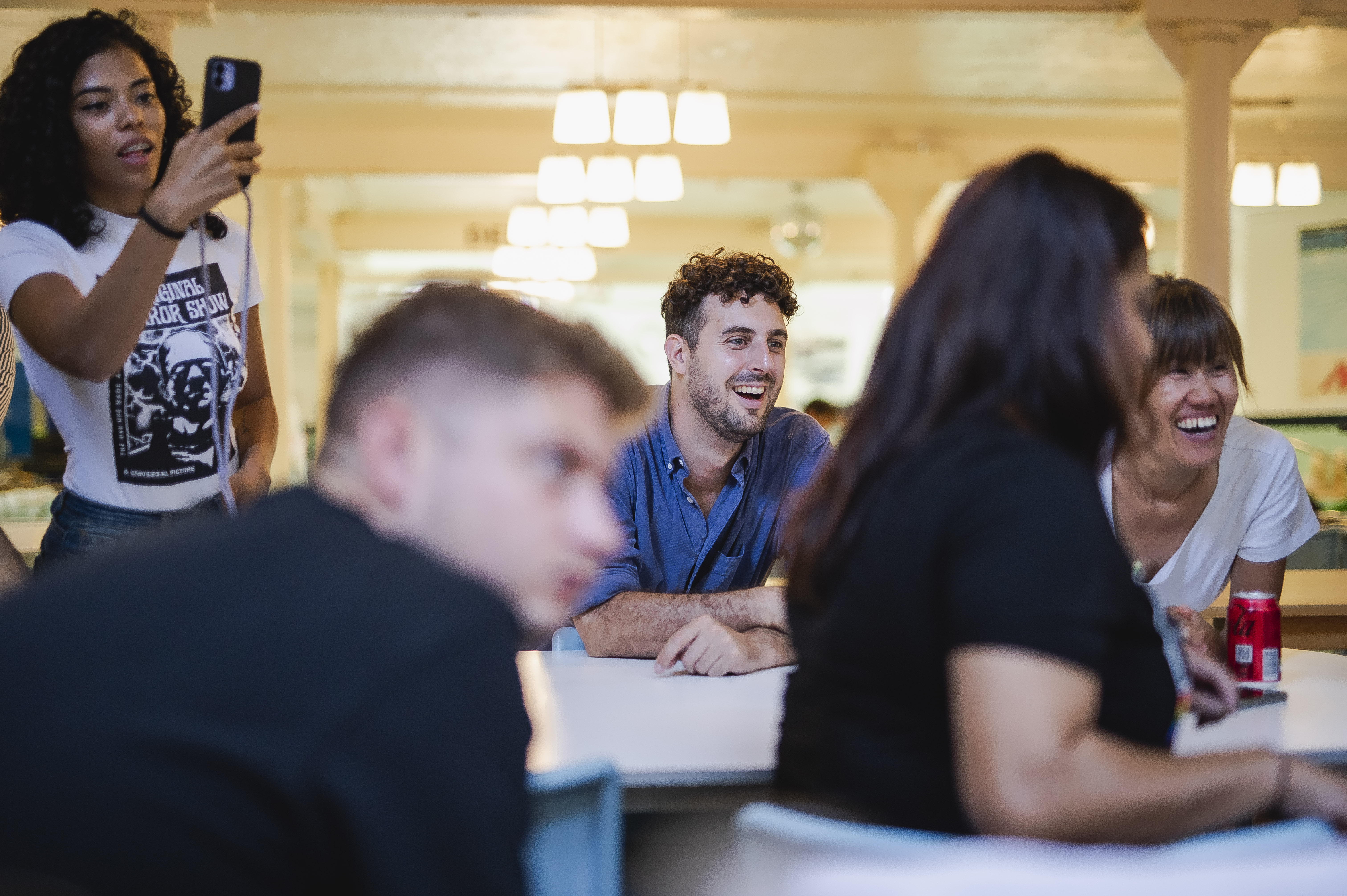 Dynamic group discussion at Covent Garden Kitchen, fostering collaboration and creativity.