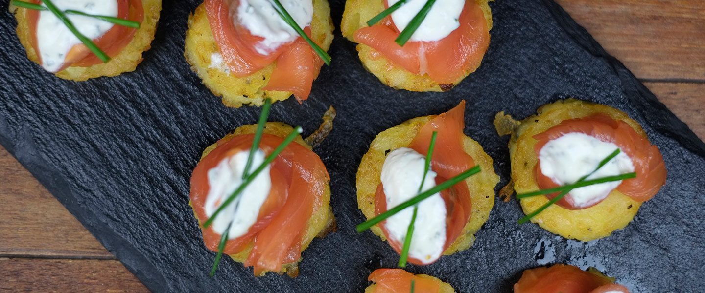 Elegant hors d'oeuvres platter with smoked salmon, ideal for upscale events and cocktail receptions.