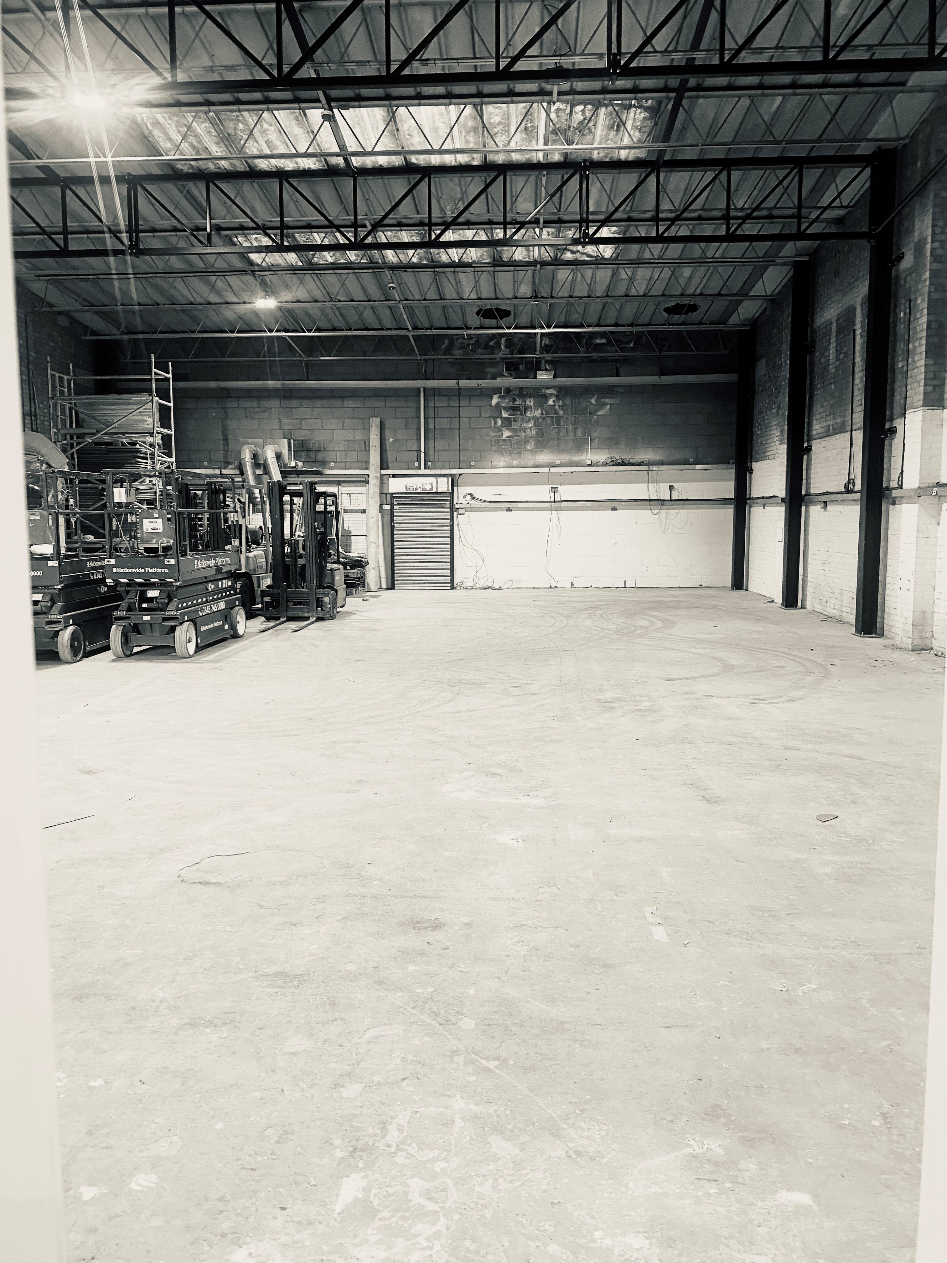 Spacious industrial venue at Dragon Smoke Studios for events and exhibitions.
