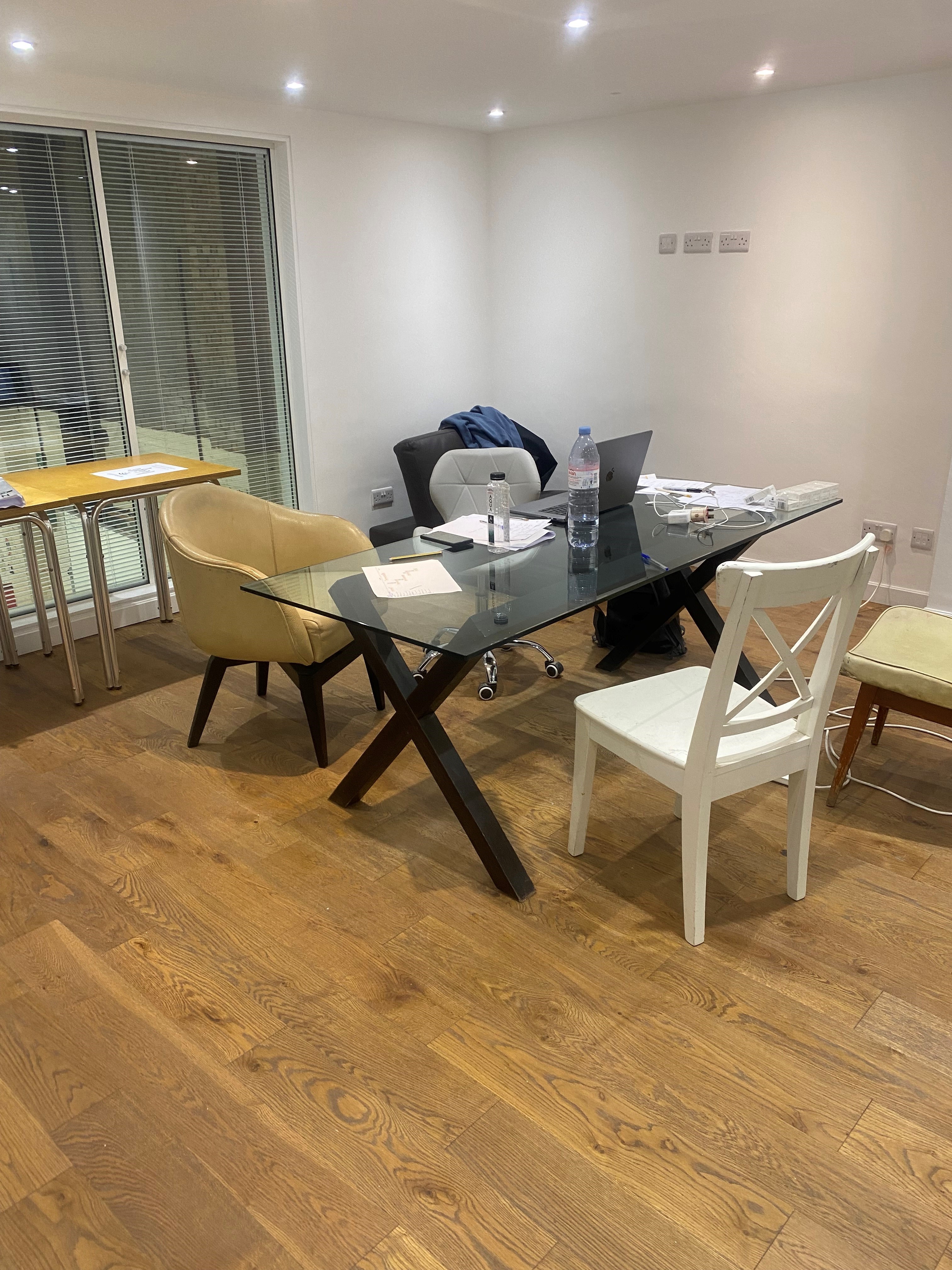 Modern meeting space at Dragon Smoke Studios with a glass table for collaborative sessions.