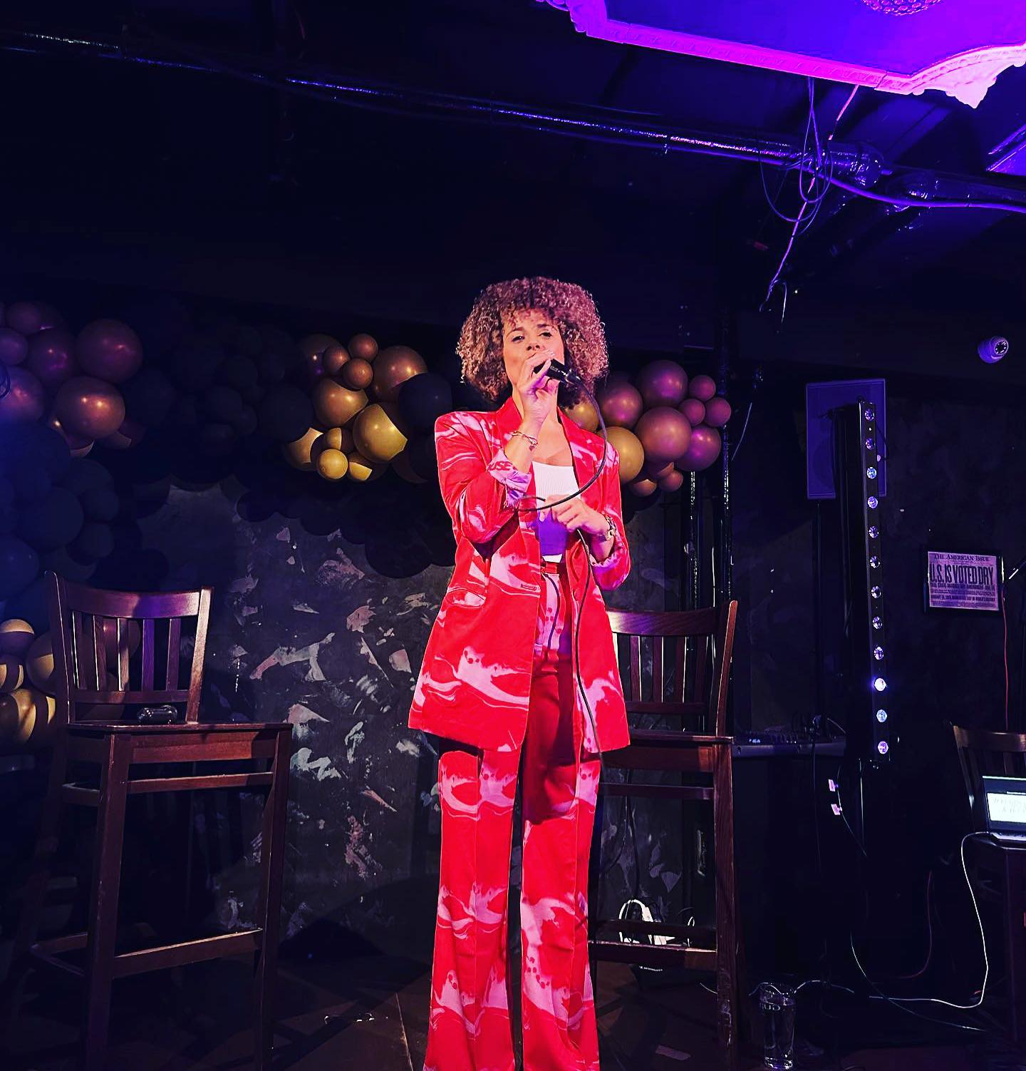 Dynamic performer on stage at The Fitzgerald Manchester, ideal for corporate events and celebrations.