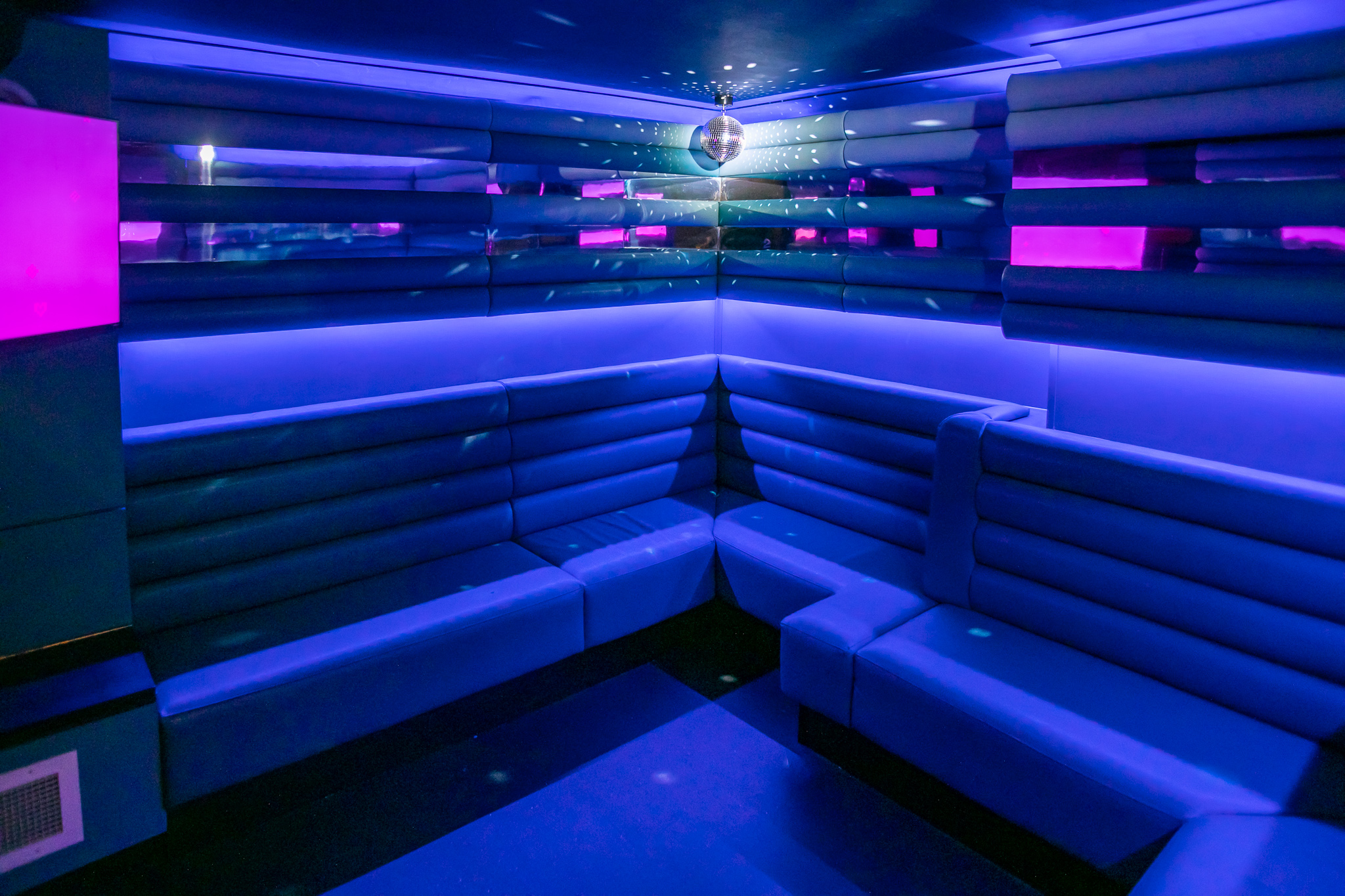 Vibrant lounge with plush seating for networking events at Lucky Voice Soho.