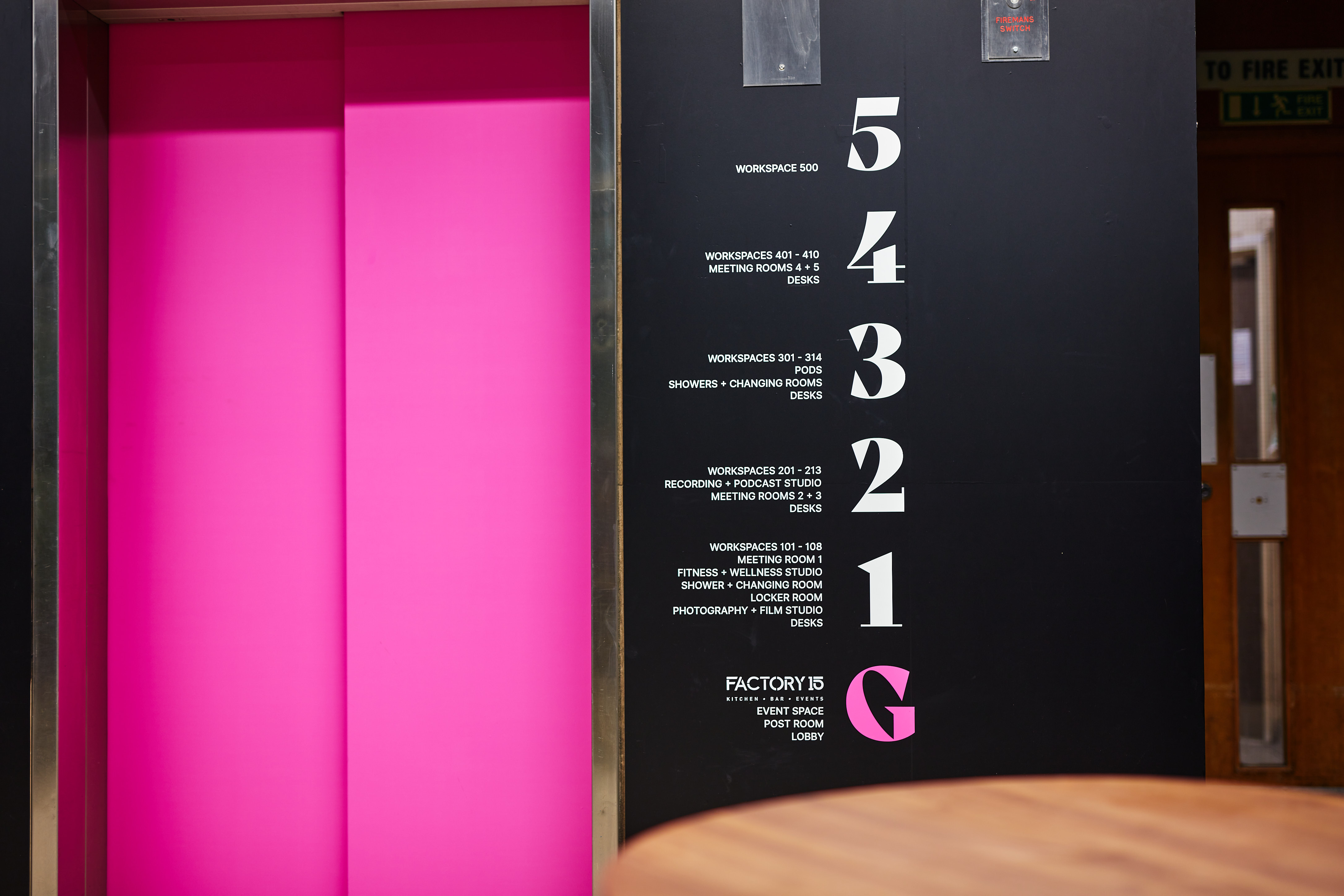 Elevator panel in vibrant pink at MAKE IT Barking, perfect for dynamic meetings and events.