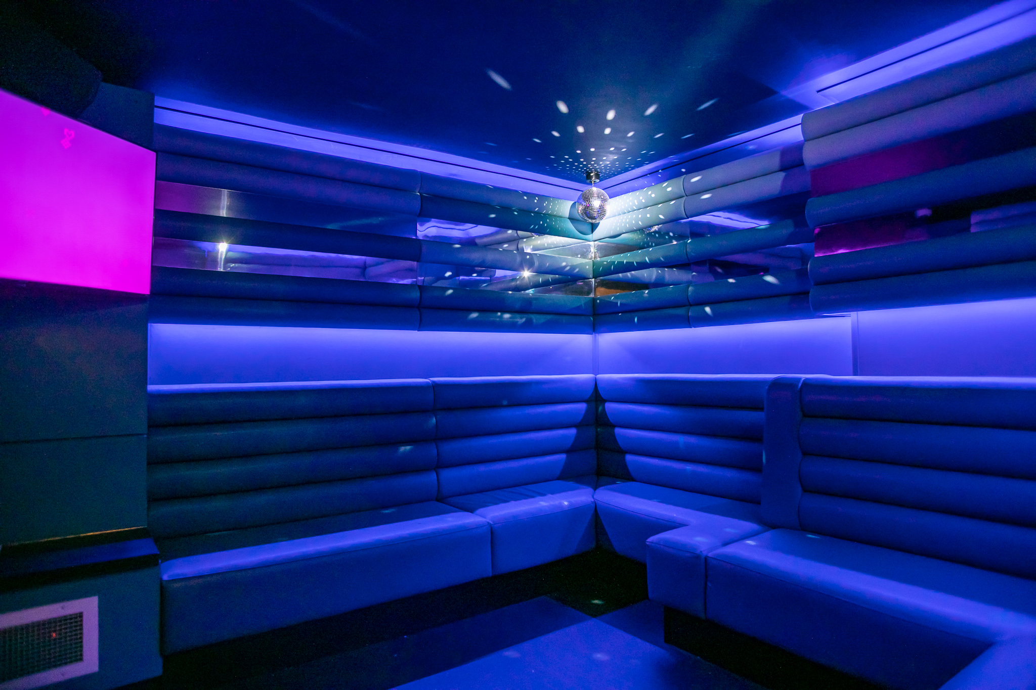 Private karaoke room in Lucky Voice Soho with vibrant lighting for events and gatherings.