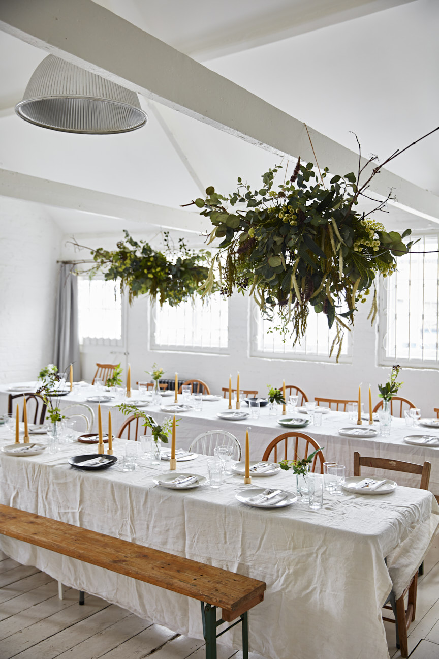 Elegant dining setup at Kemble House Studio with greenery for special events.