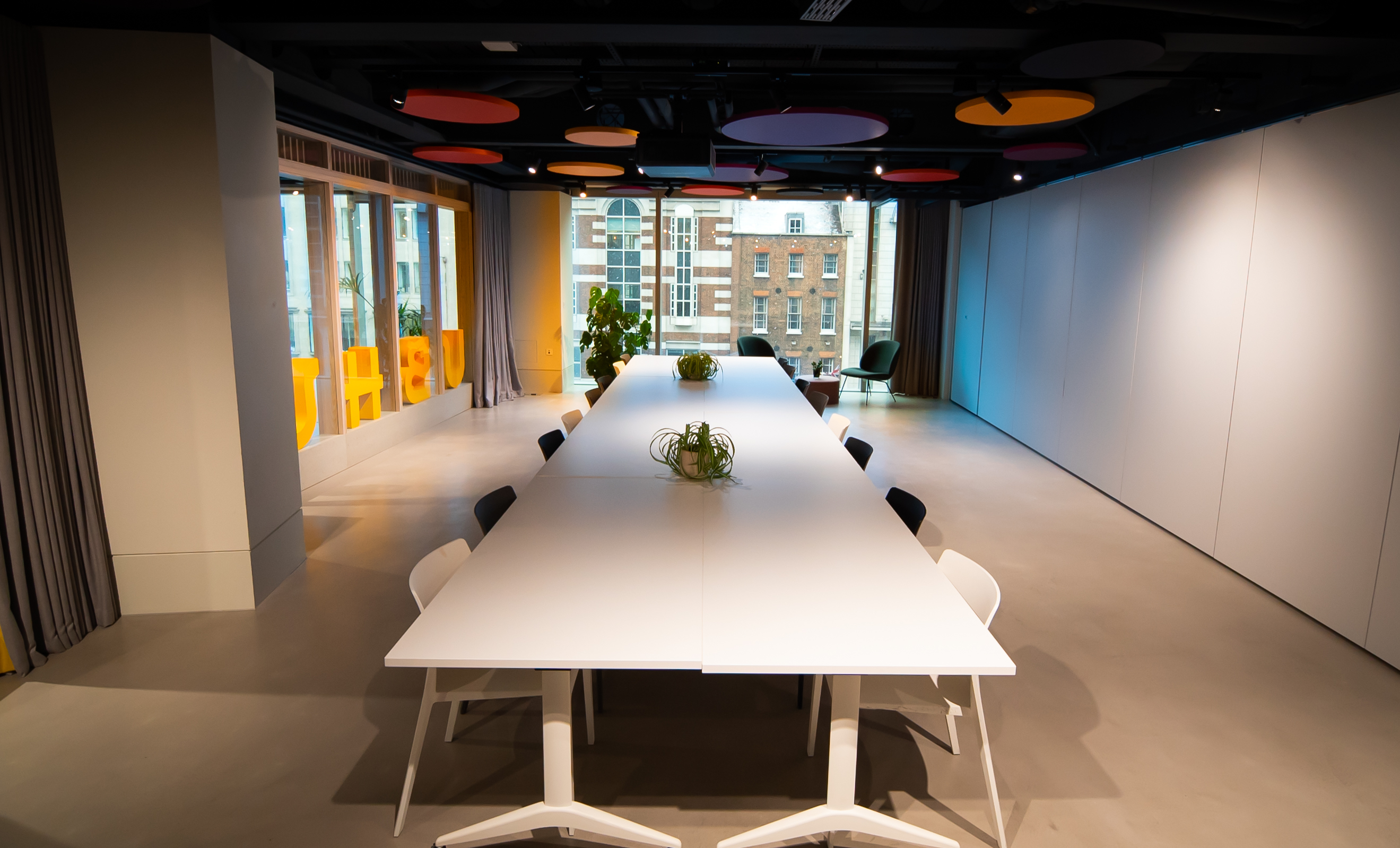 Modern Katherine Johnson Boardroom with sleek table, ideal for meetings and brainstorming.