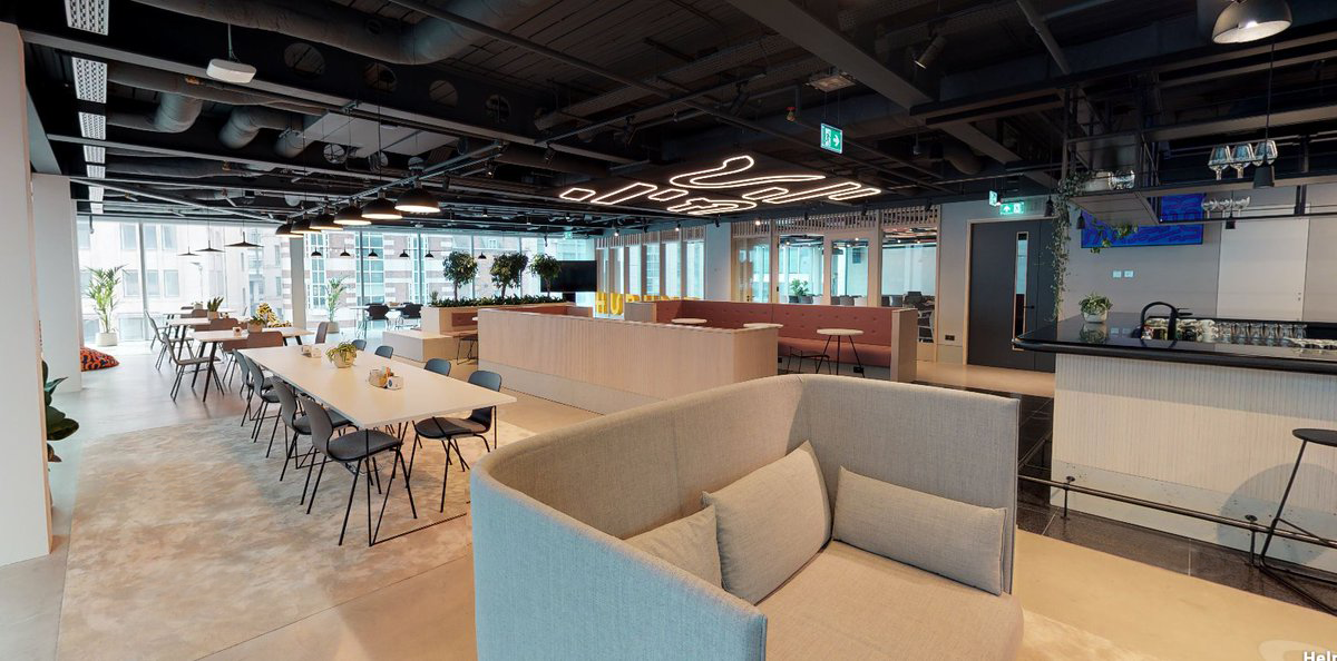 Modern business lounge with flexible seating for networking and meetings.