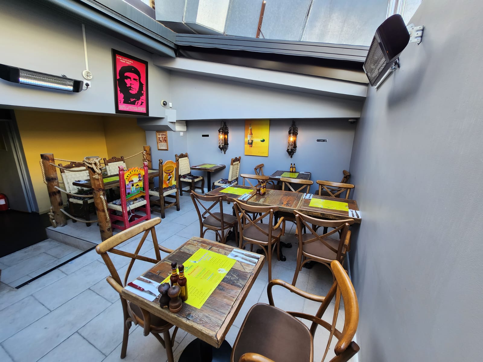 Terrace in Desperados: modern venue with yellow accents for casual meetings and events.