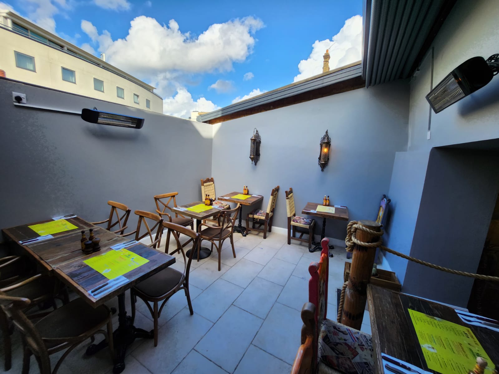 Inviting outdoor terrace with rustic furniture for casual gatherings in Desperados.