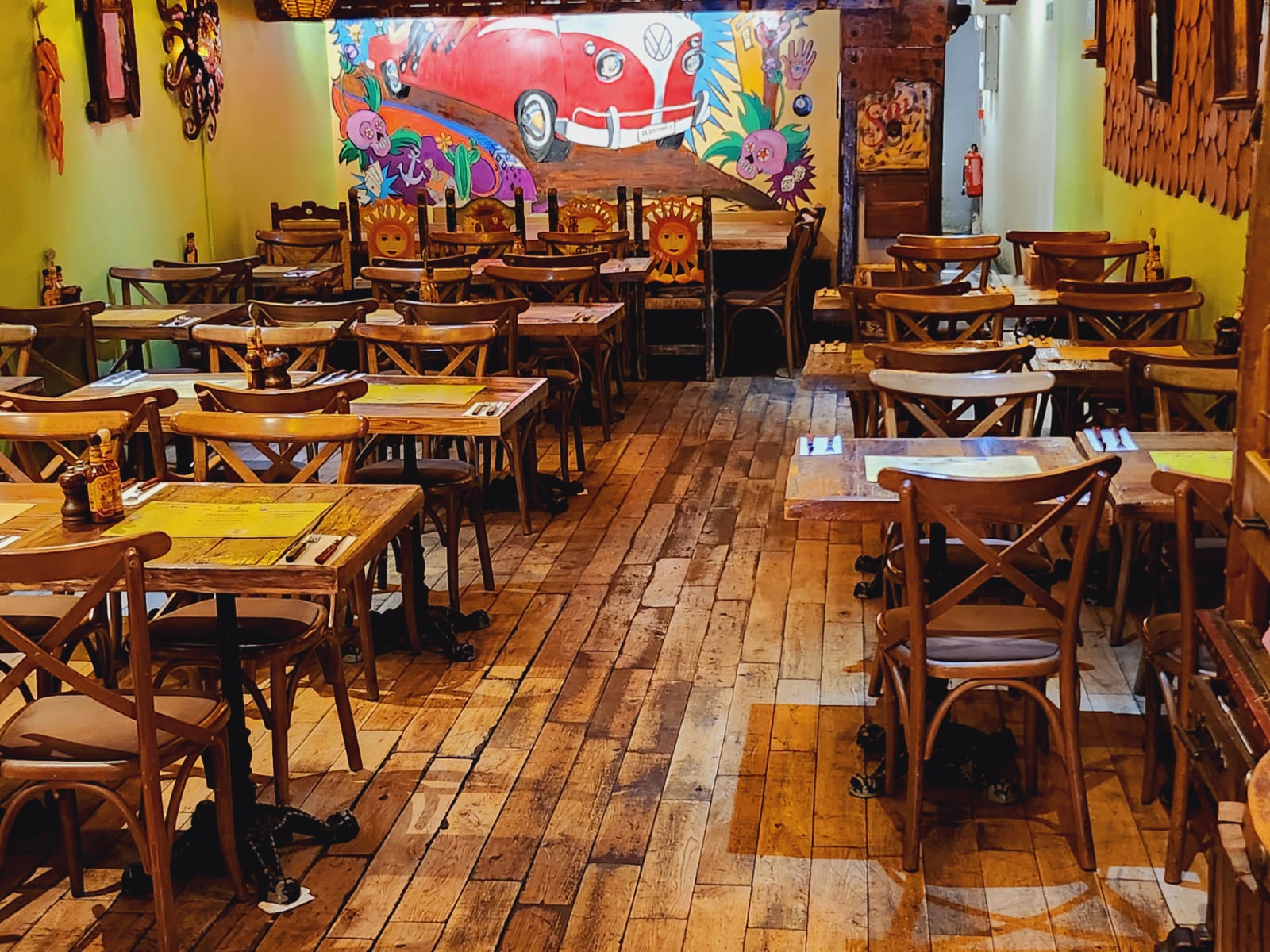 VW bar area in Desperados, rustic wooden tables, perfect for team-building events.