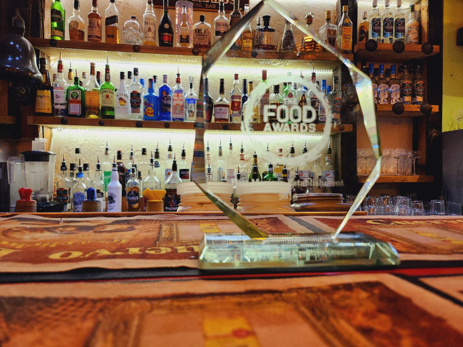"Sleek award on polished bar at Desperados, perfect for networking and celebrations."