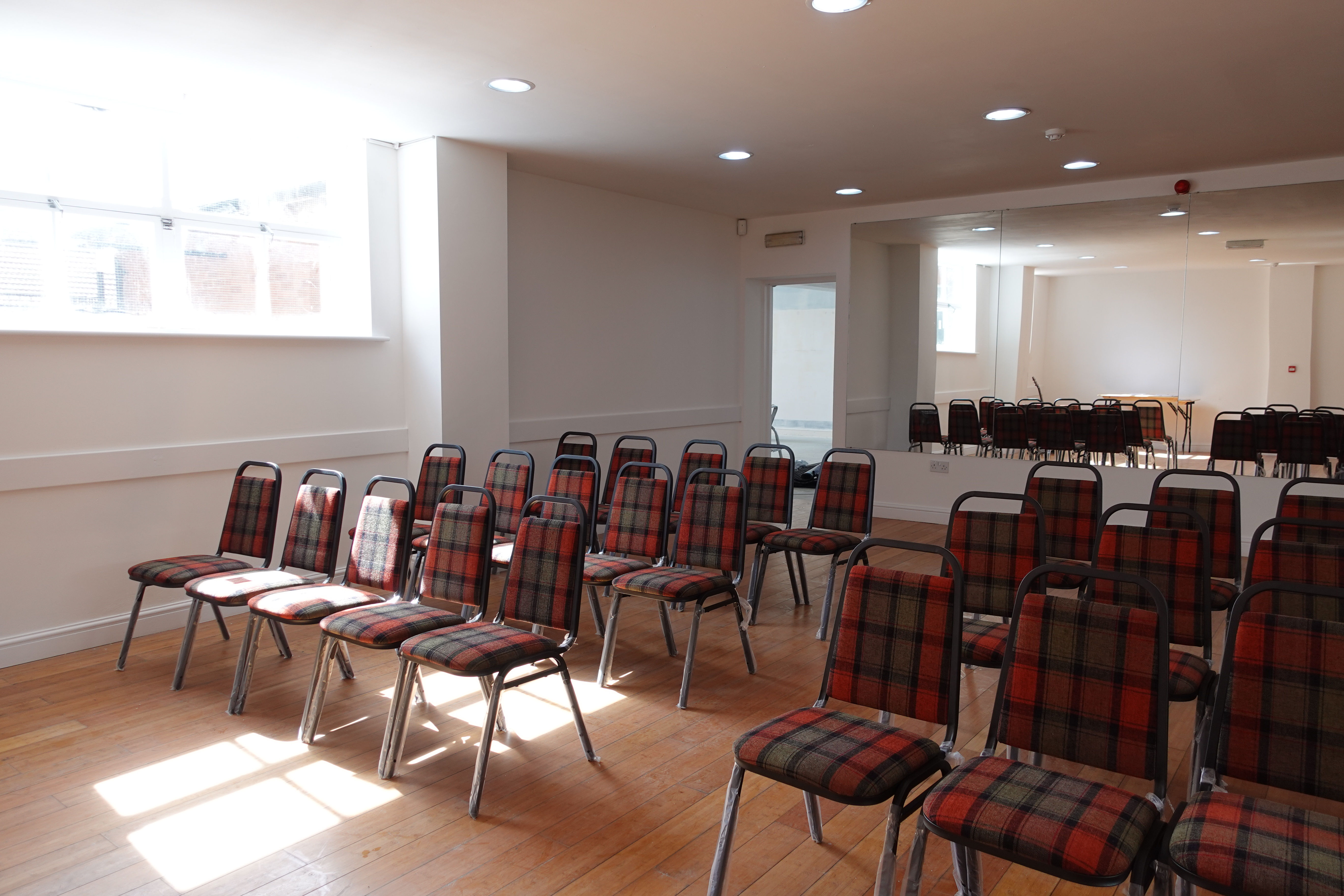 Bennies Kitchen meeting space with natural light, perfect for workshops and presentations.