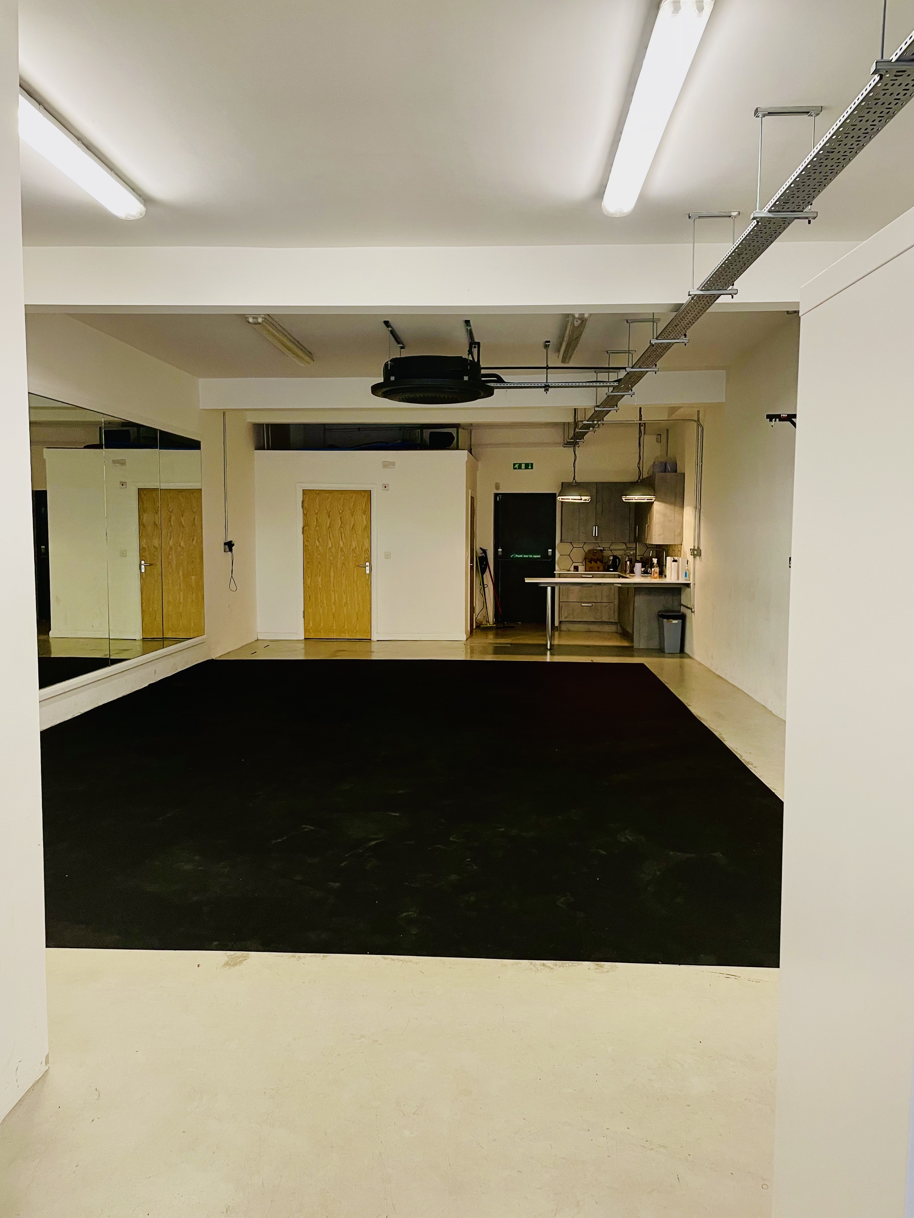 Versatile event space in Jump Studios Bristol with mirrored walls for workshops and fitness classes.