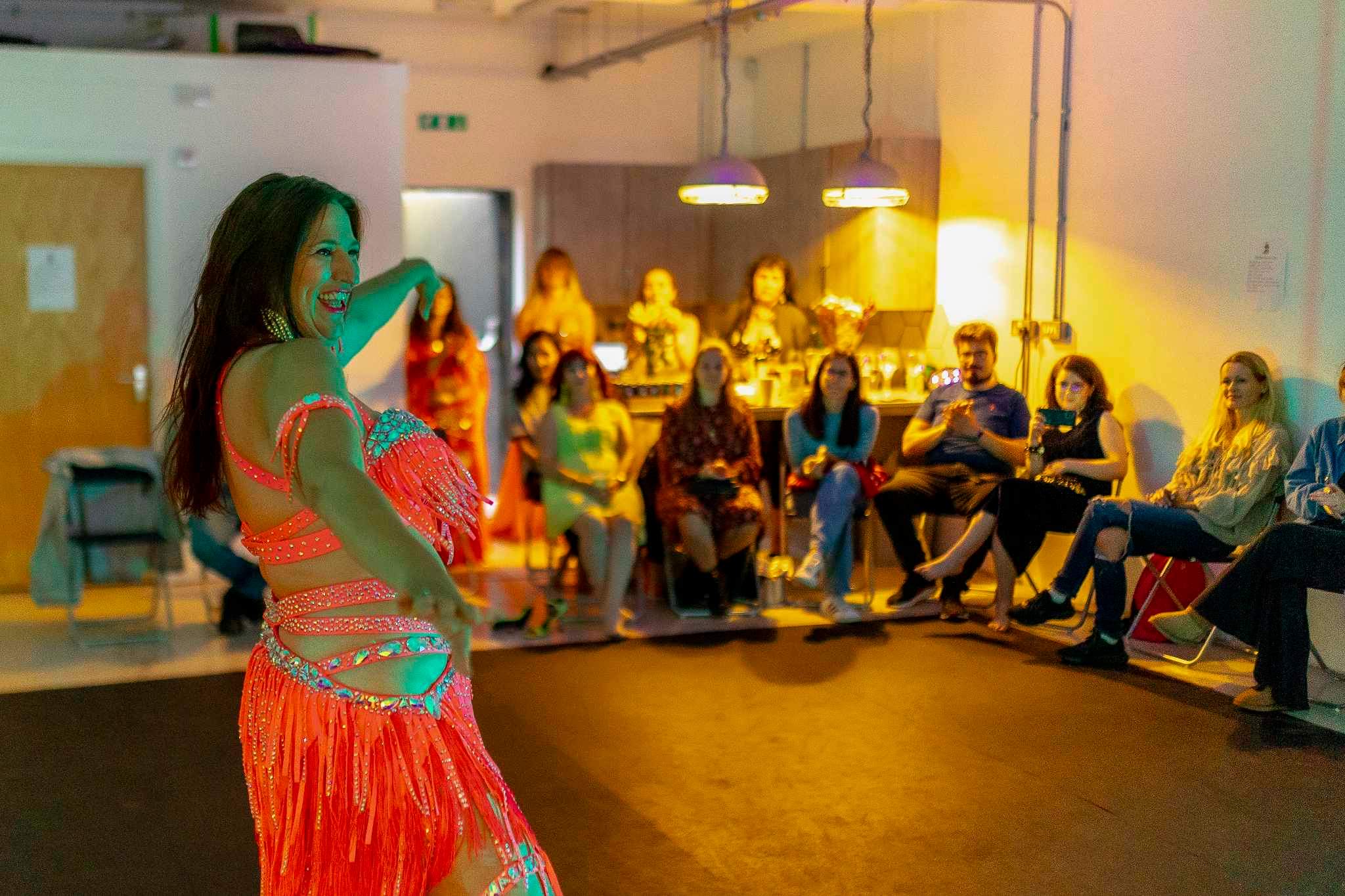 Belly dancer performing at Jump Studios Bristol, vibrant event entertainment setting.