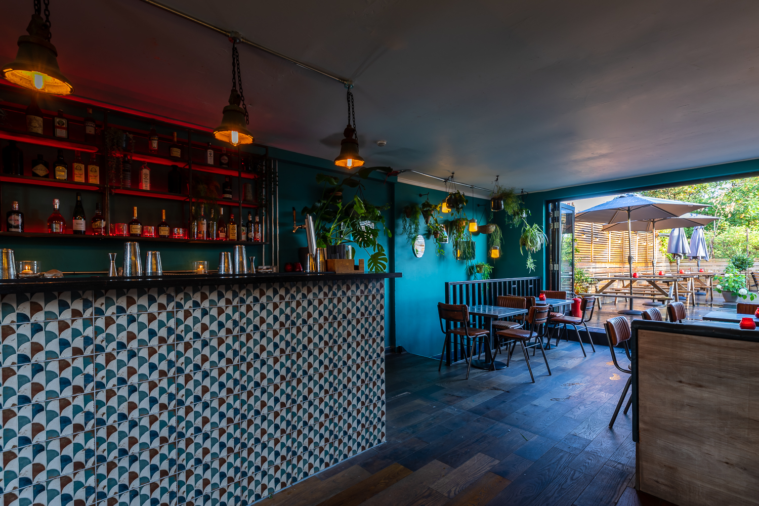 Stylish TOLA Main Room with geometric tiles, ideal for events and gatherings.