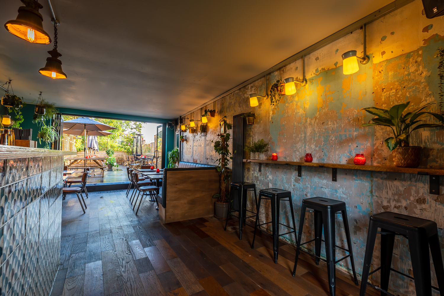 TOLA Main Room: cozy venue with rustic decor for networking events and gatherings.
