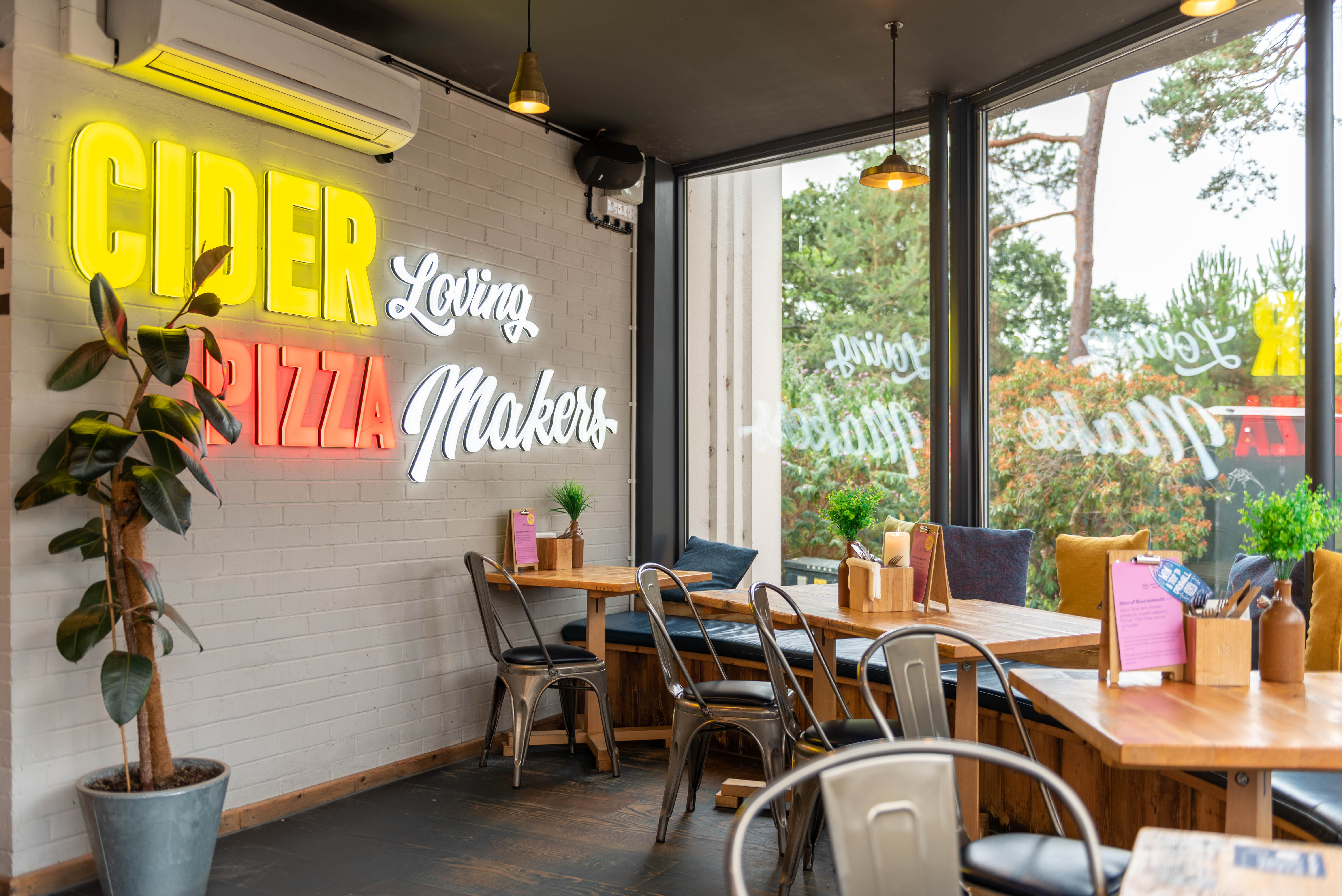 Vibrant venue hire in The Bournemouth Stable with neon decor for casual events.