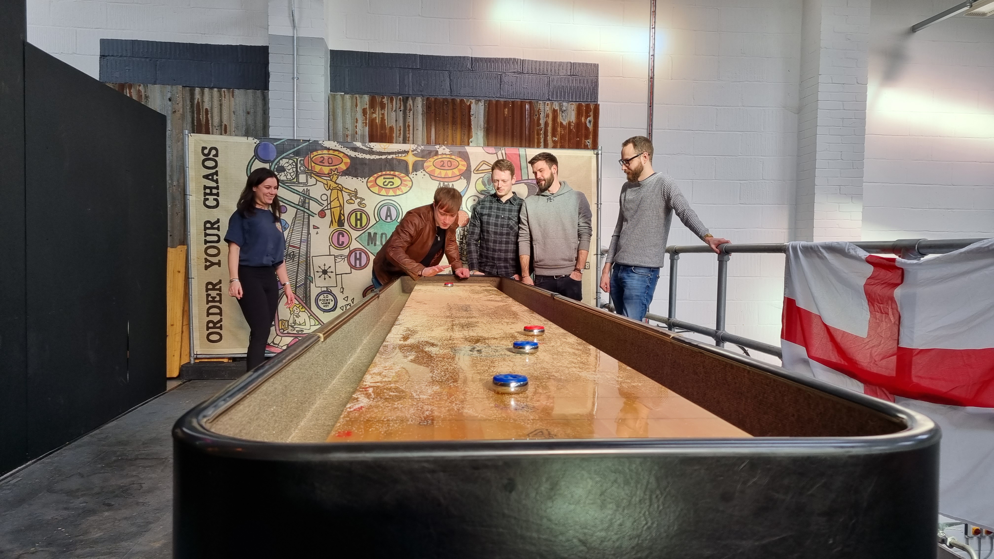 Team-building activity in The Mezzanine at dISruption Brewery, fostering collaboration and engagement.