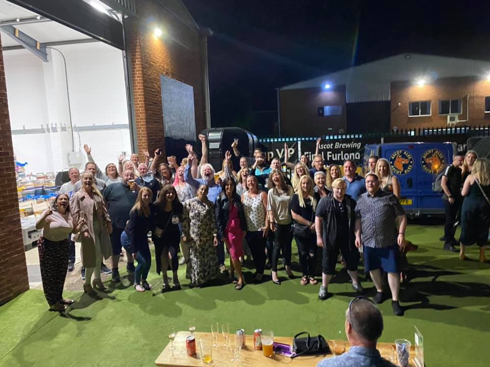 Vibrant outdoor networking event at The Mezzanine, Disruption Brewery & TapHouse.