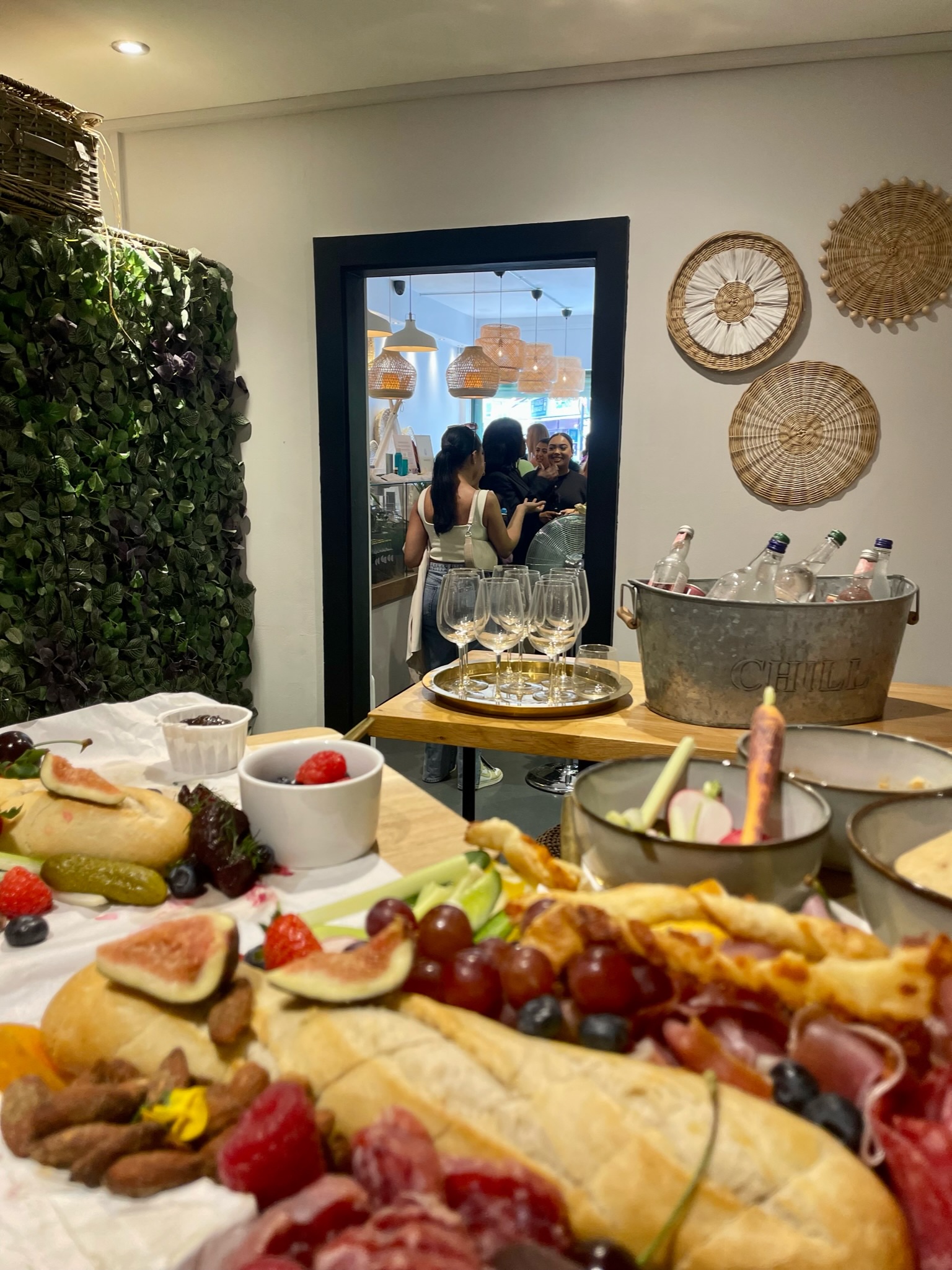 Vibrant event space at Luxury Picnic Cafe with elegant food display for social gatherings.