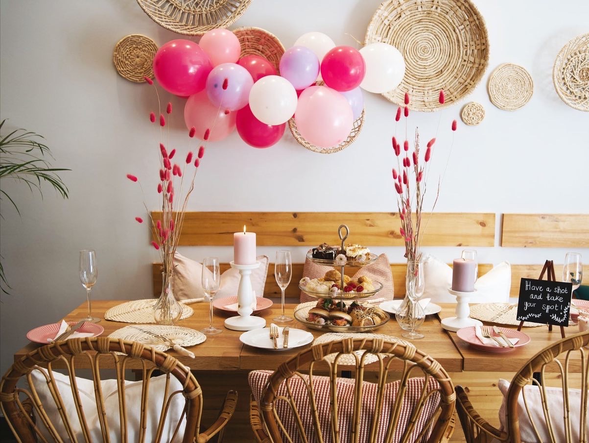 Elegant event space with pastel balloons for baby showers and birthday parties.