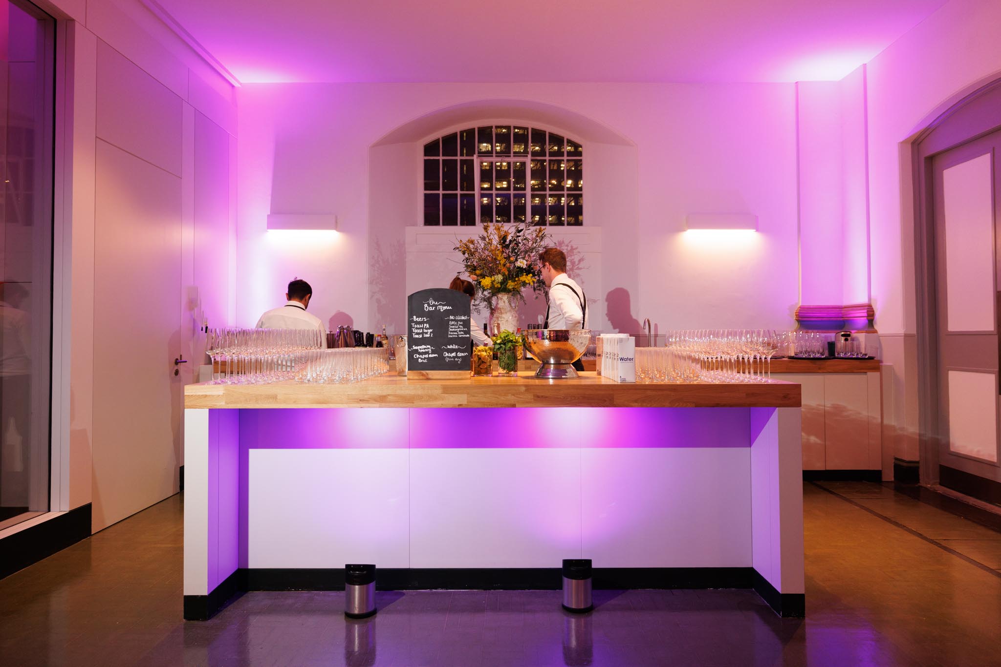 Stylish event bar at The Nave, 73 Waterloo, with elegant lighting and attentive service.