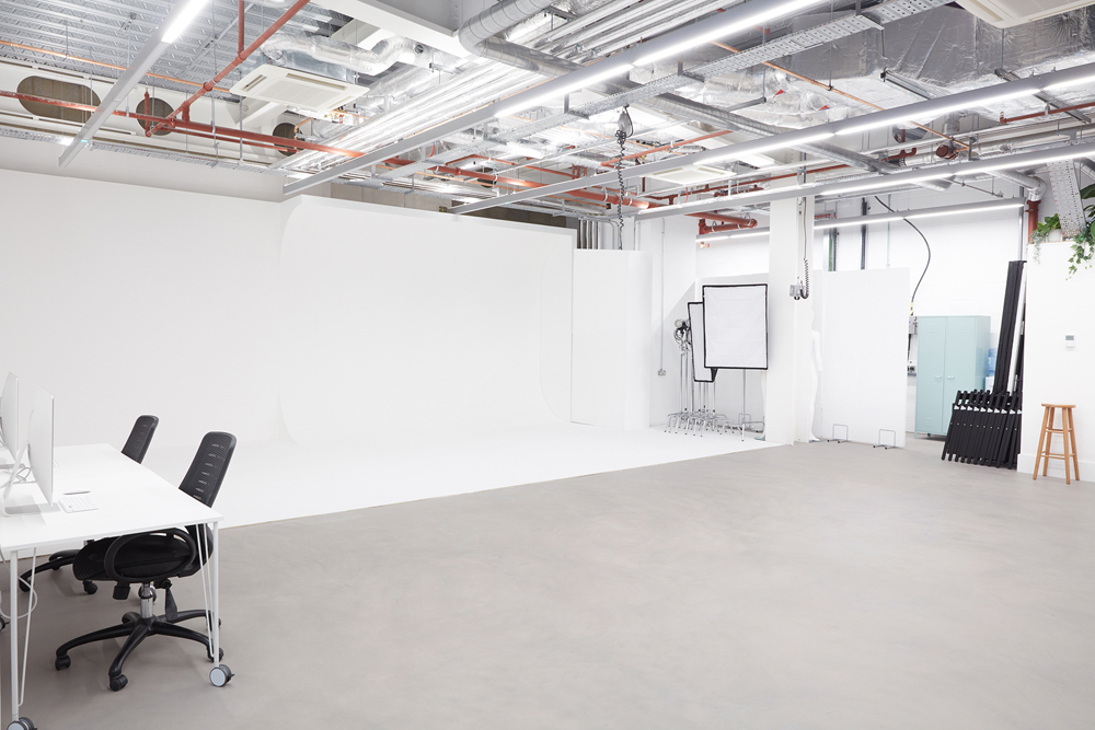Versatile event space with minimalist design for meetings and workshops at The Vow Studio.