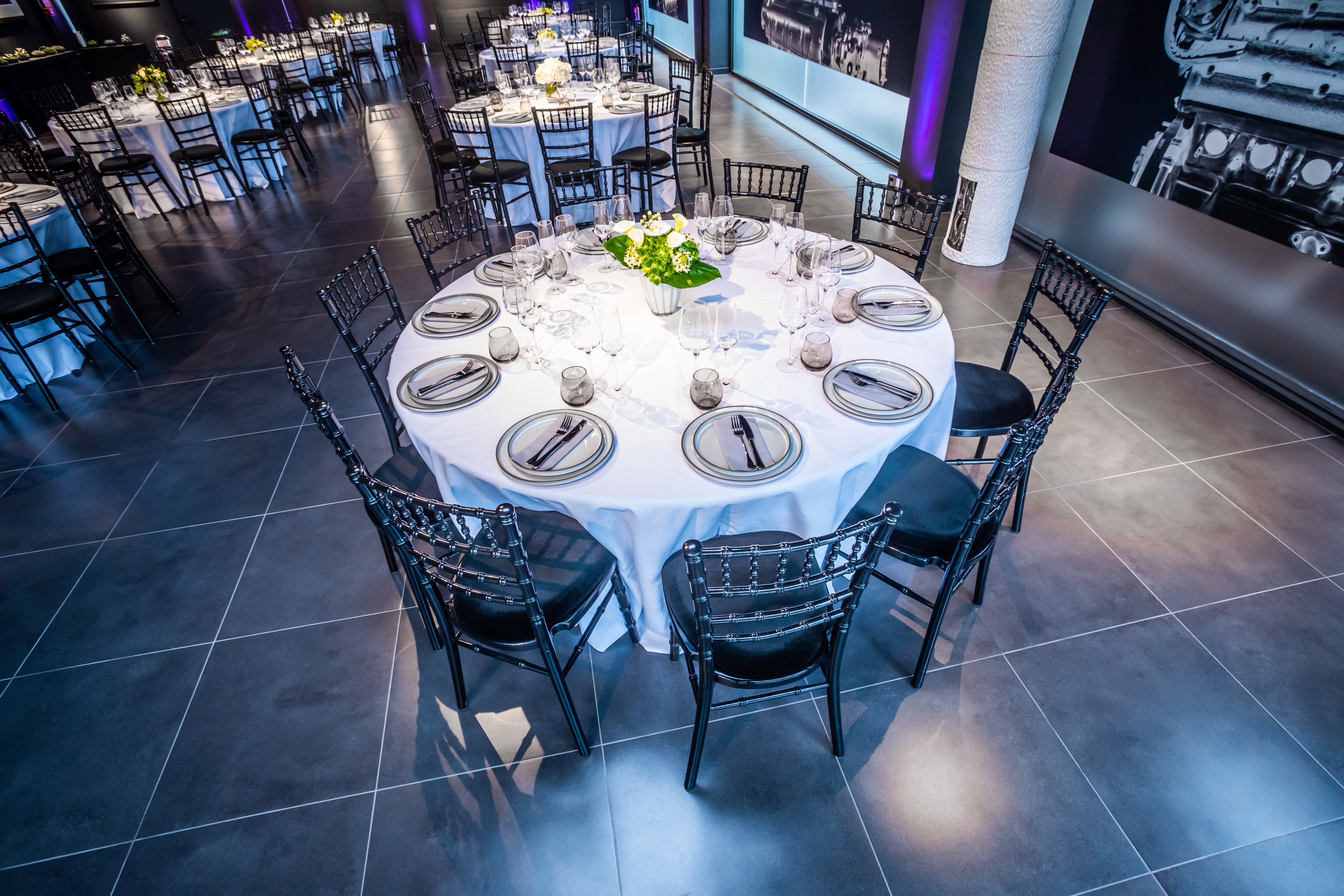 Elegant round table setup in The Engine Rooms for corporate dinners and formal events.