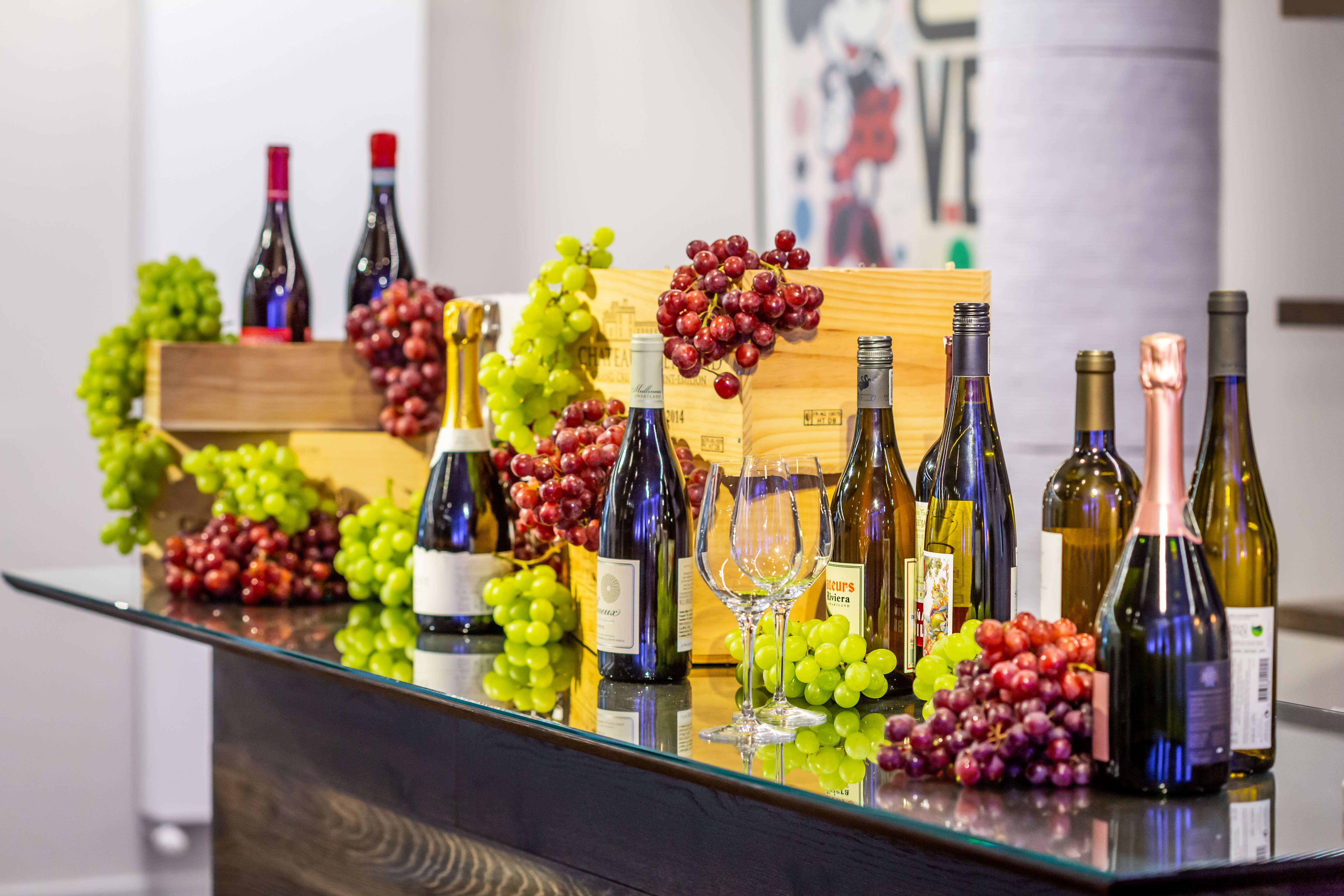 Elegant wine display with fresh grapes in The Engine Rooms for tastings and receptions.