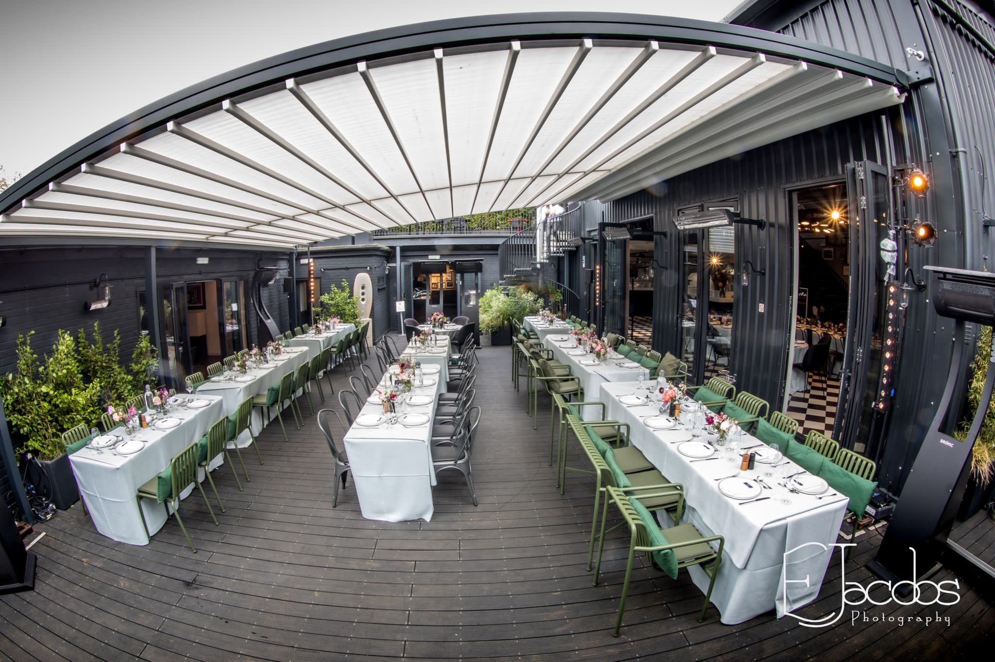 Outdoor dining space with elegant tables, perfect for events and gatherings.