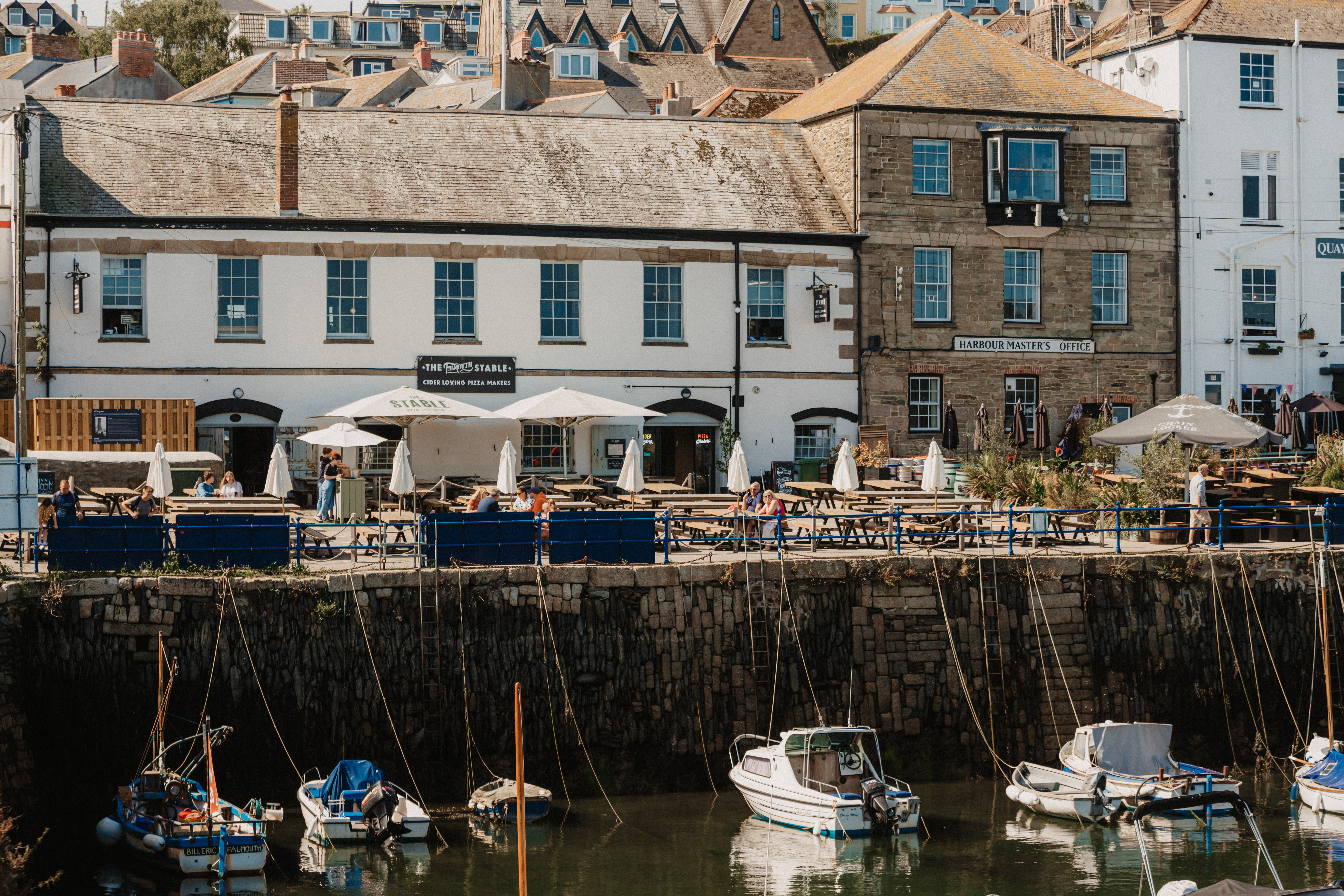 Charming waterfront venue for events with outdoor seating and scenic views.
