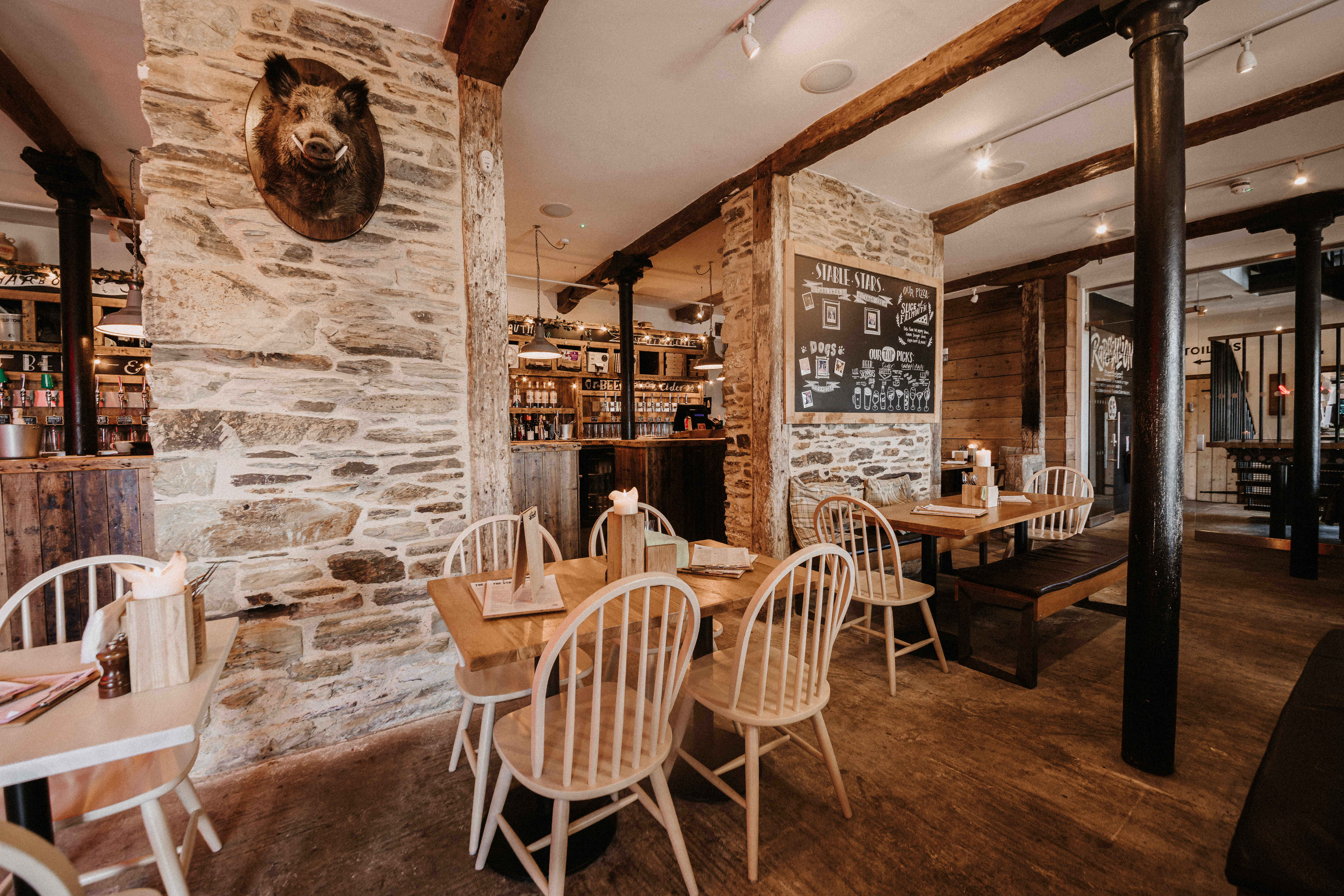 Rustic venue hire at The Falmouth Stable, ideal for casual meetings and small events.