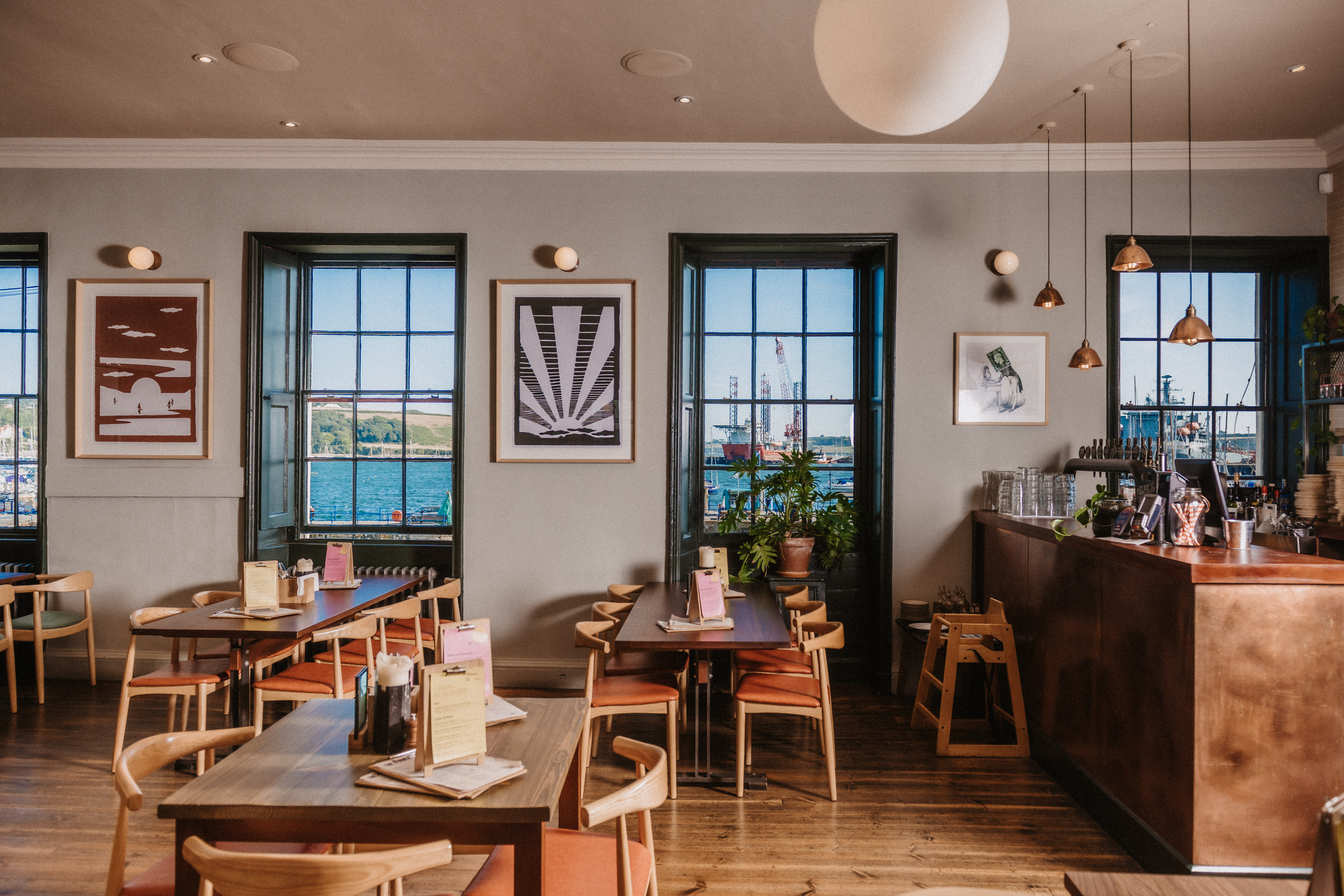 Stylish waterfront venue with large windows for intimate meetings and events.