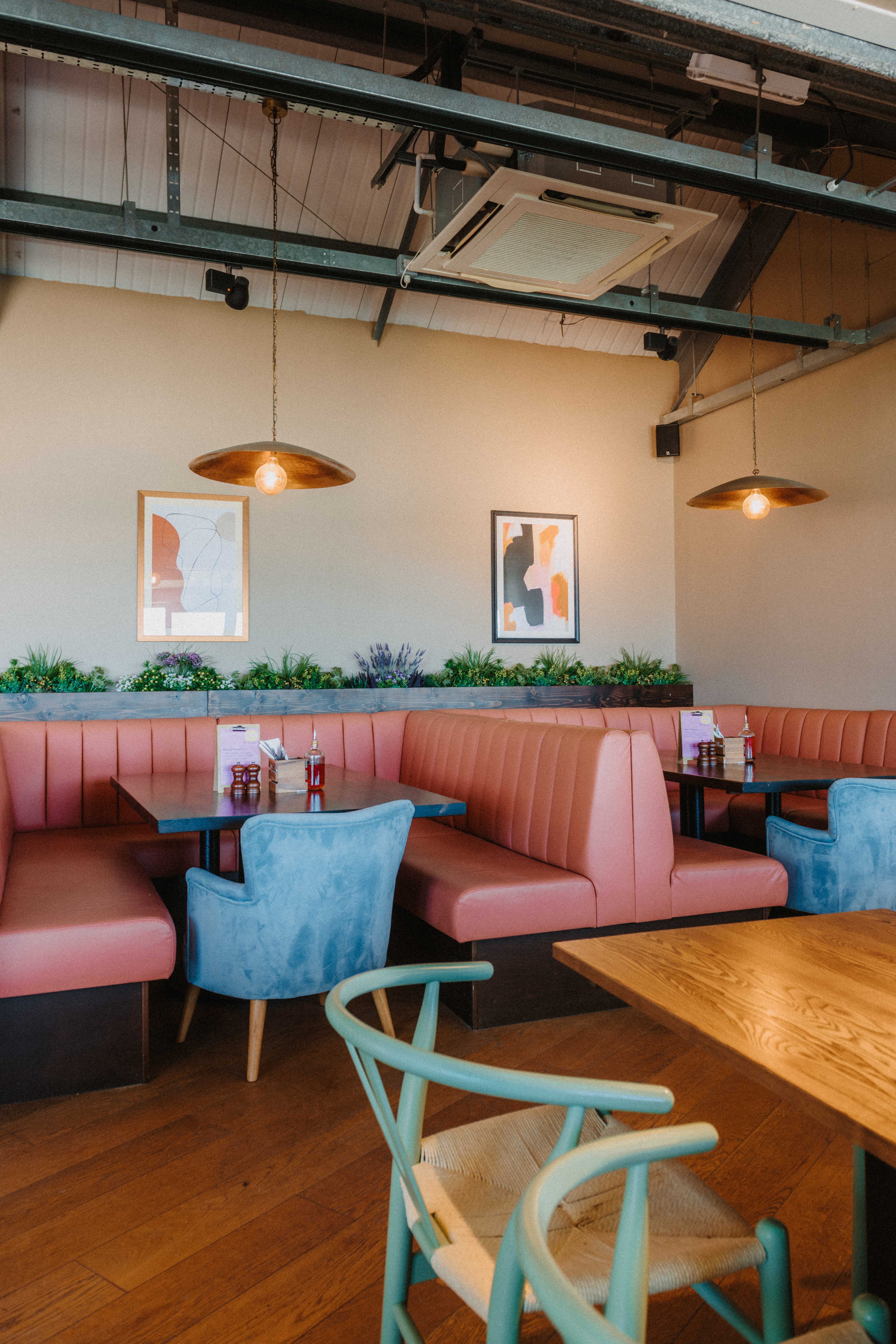 Cozy booth seating in Longboard Bar, ideal for intimate meetings and casual gatherings.