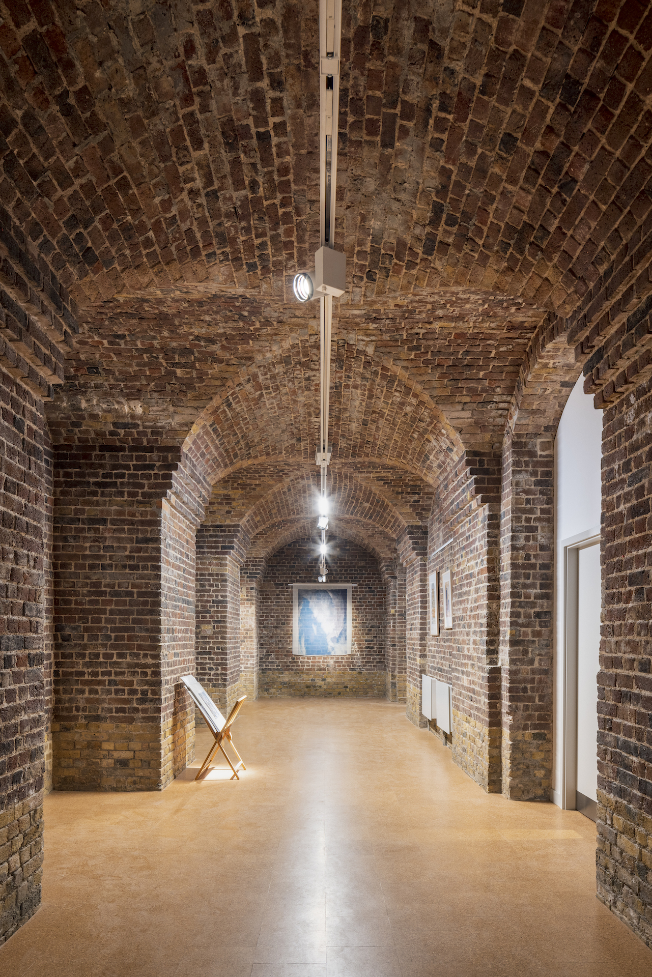 Brick archway at 73 Waterloo, perfect for intimate gatherings and art exhibitions.