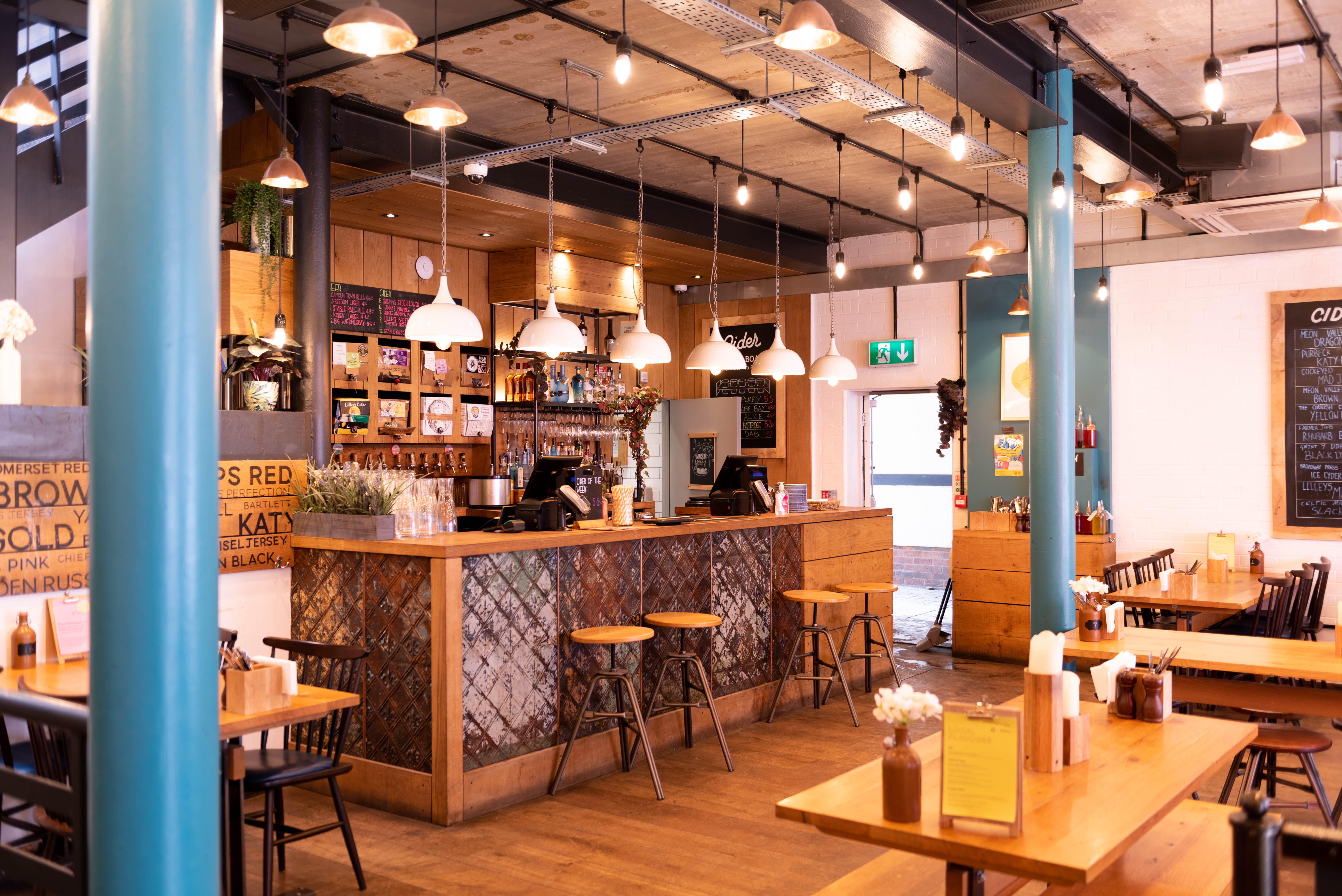 Modern café venue with warm wood accents for networking events and informal meetings.