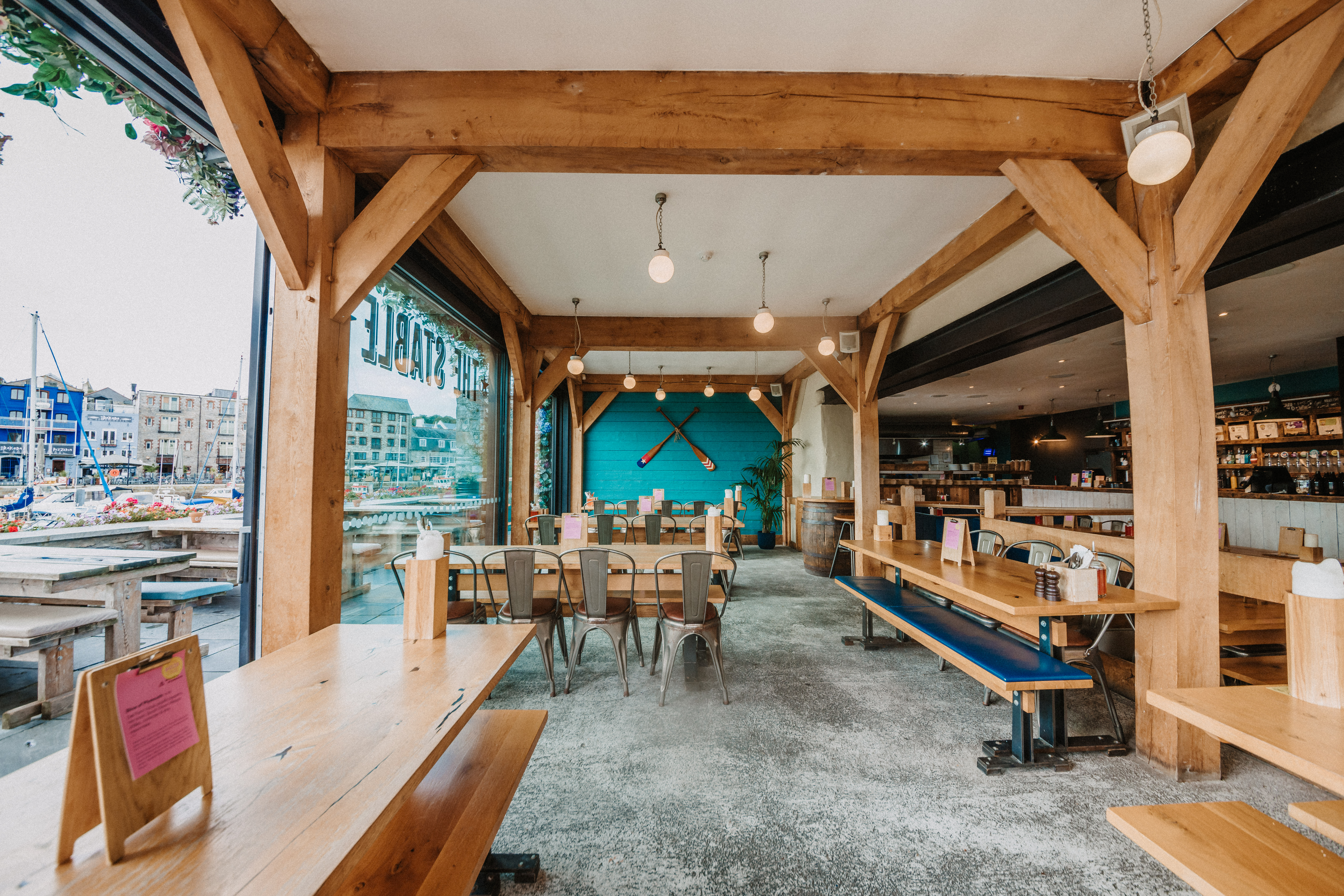 Spacious venue with wooden beams, perfect for networking events and team meetings.