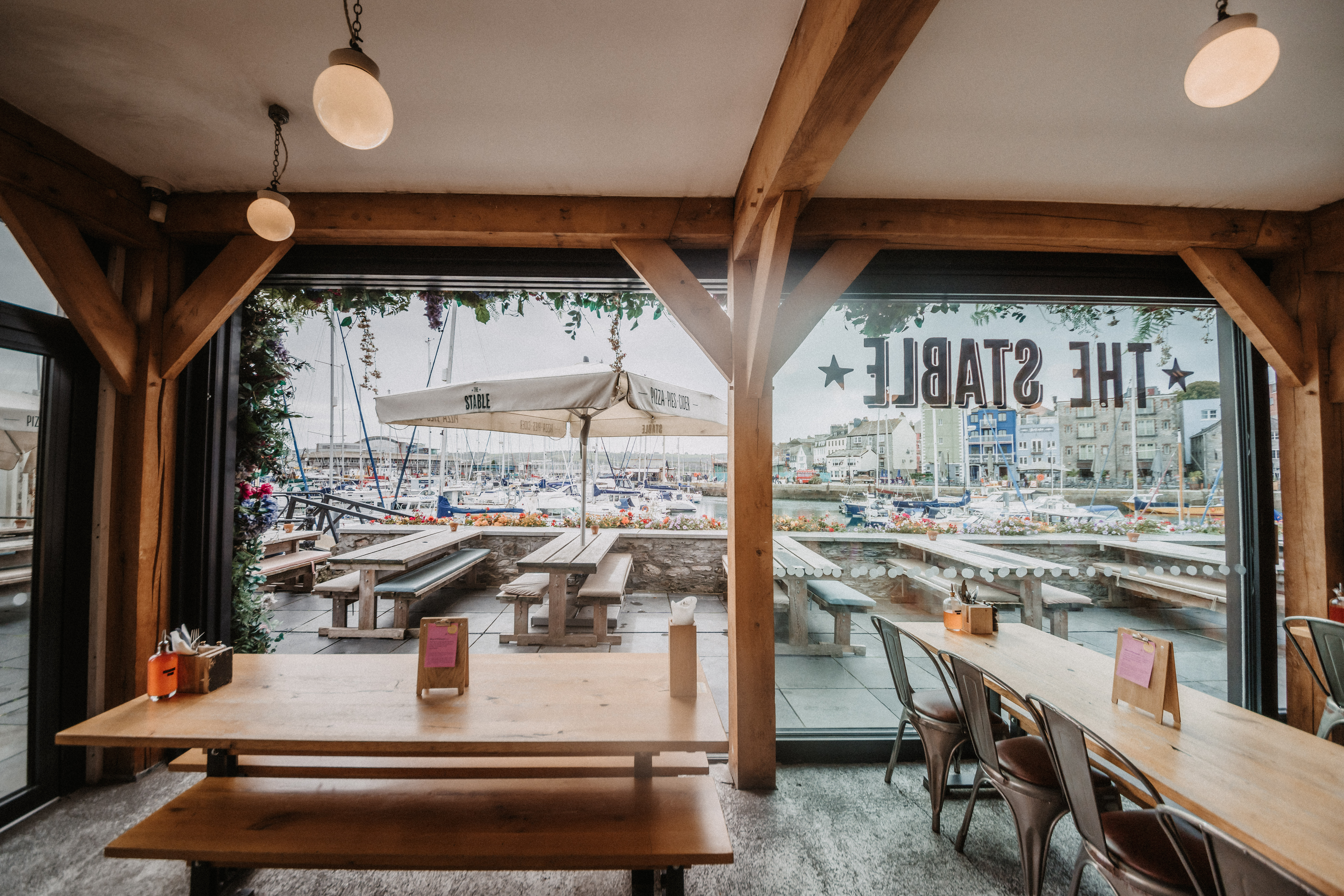 Stylish venue with large windows for networking events at The Plymouth Stable.