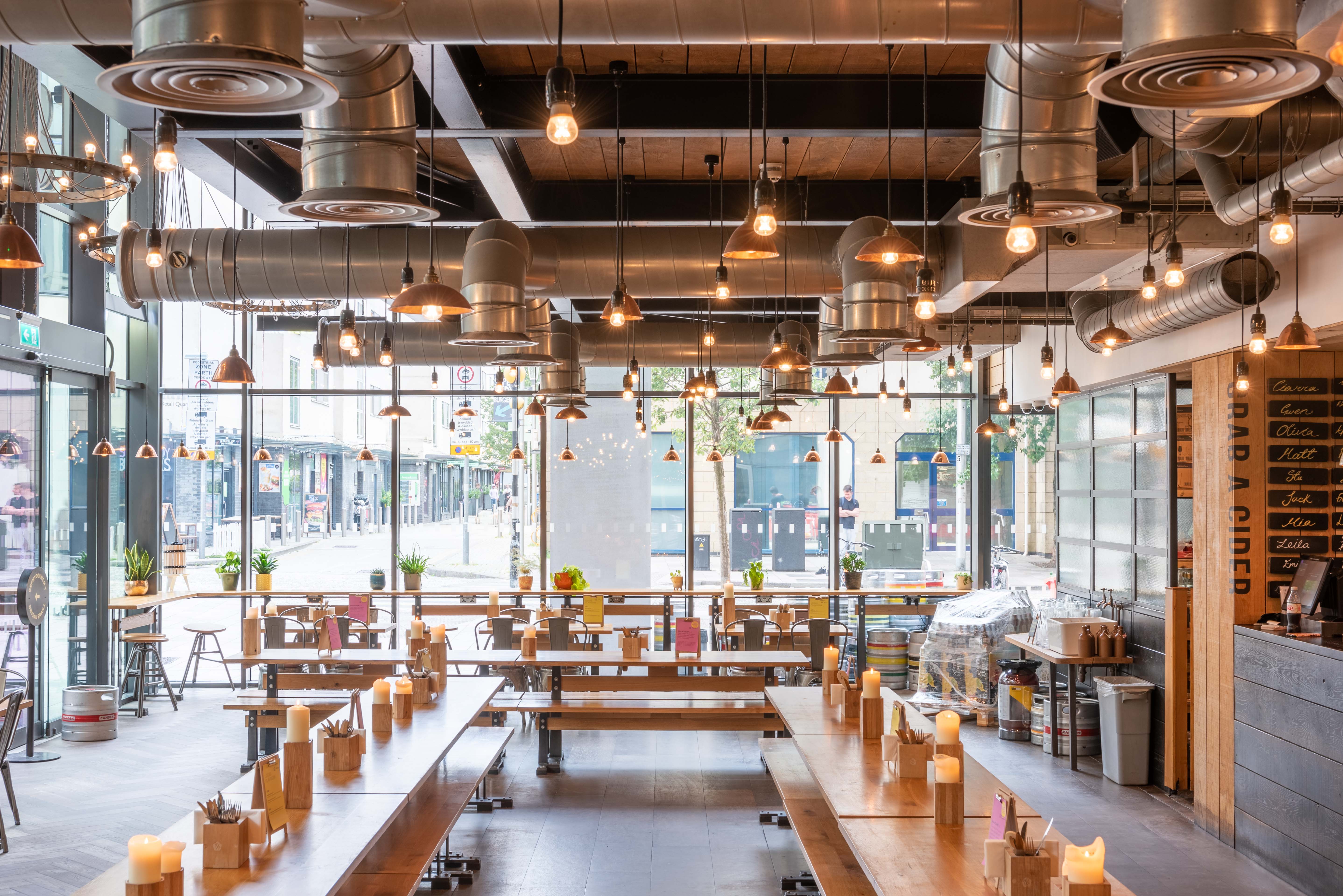 Modern open-concept dining space for casual meetings and networking events in Cardiff.