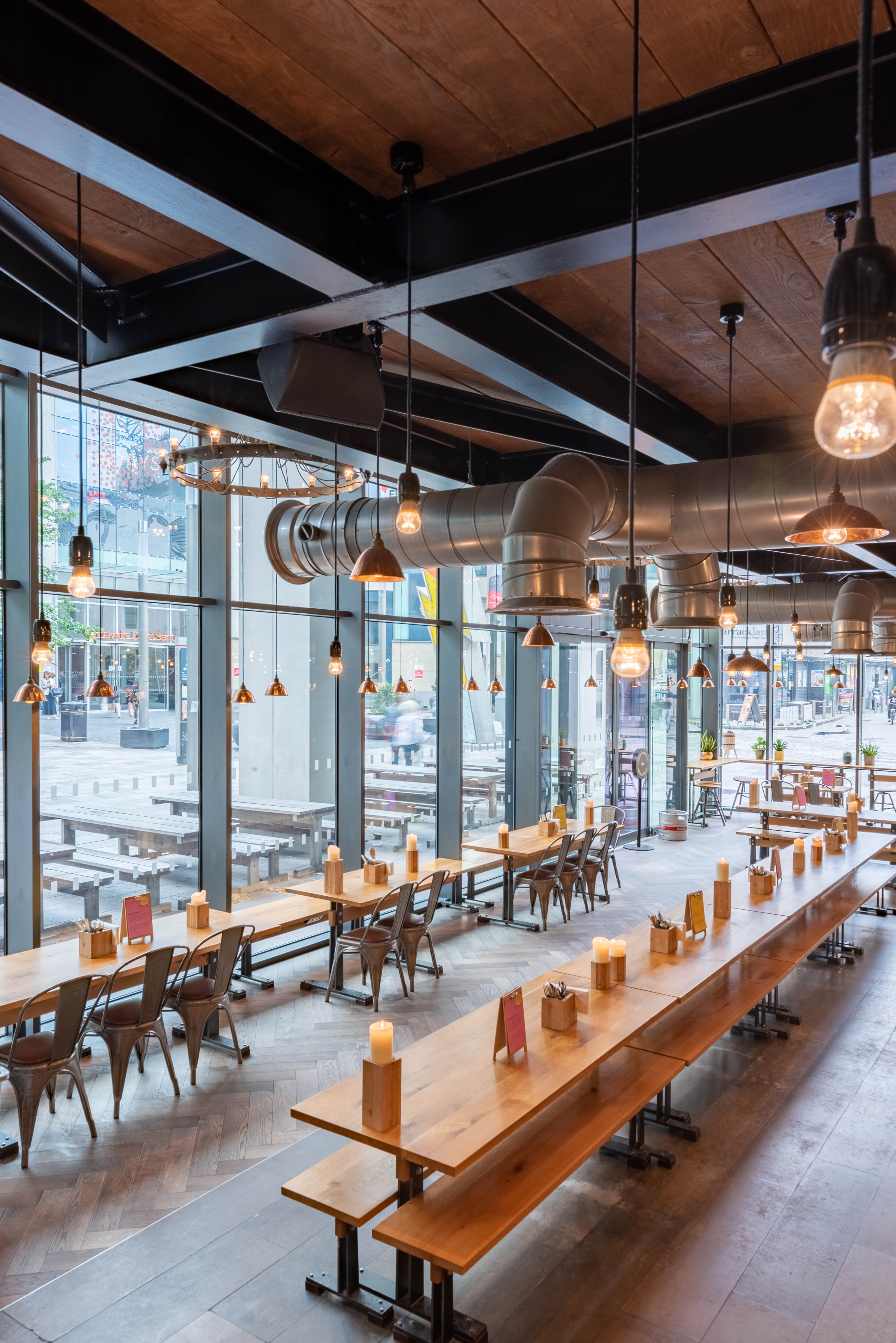 Modern event space with large windows, ideal for networking and receptions in Cardiff.