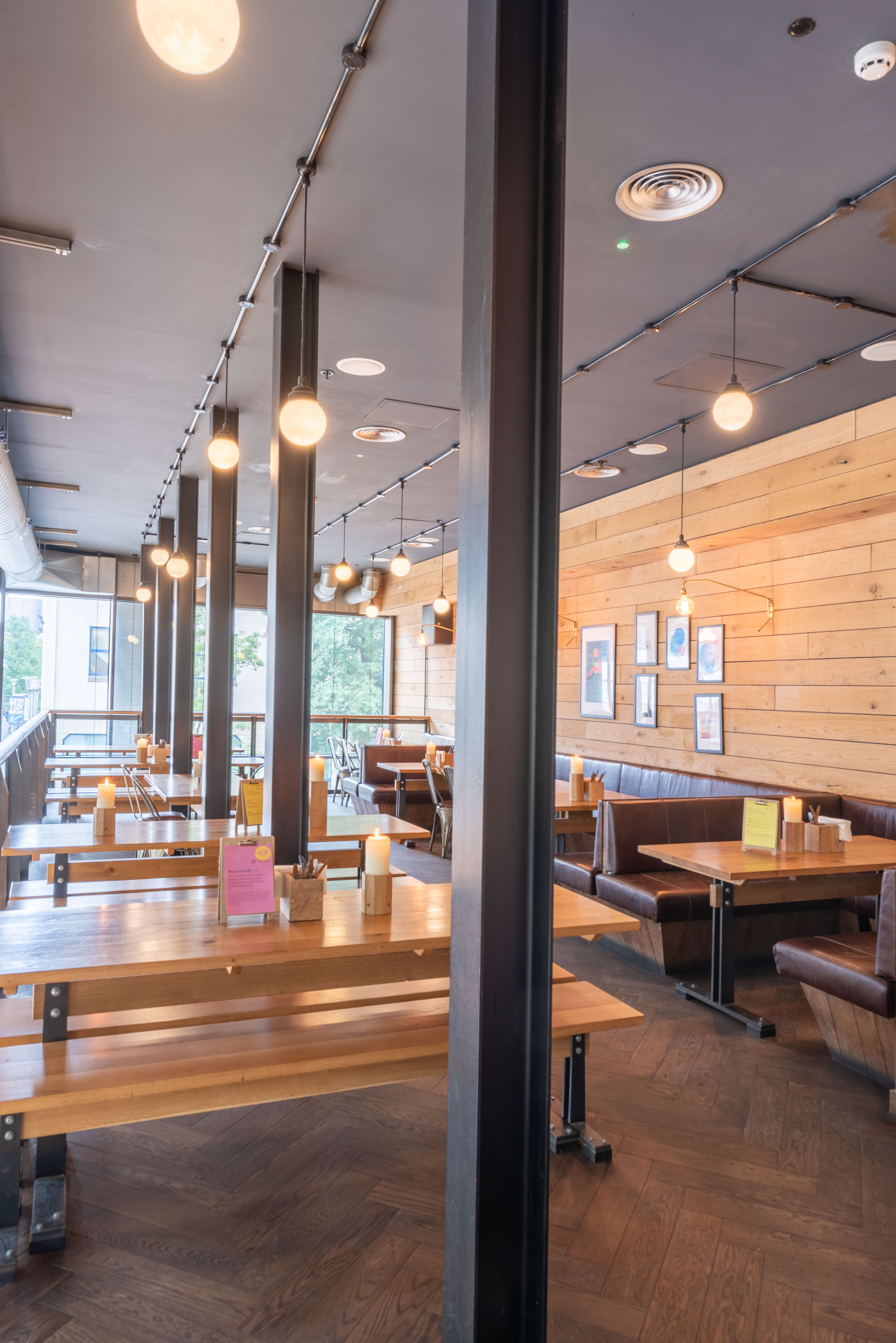 Modern restaurant space with warm wood accents, ideal for networking events and meetings.