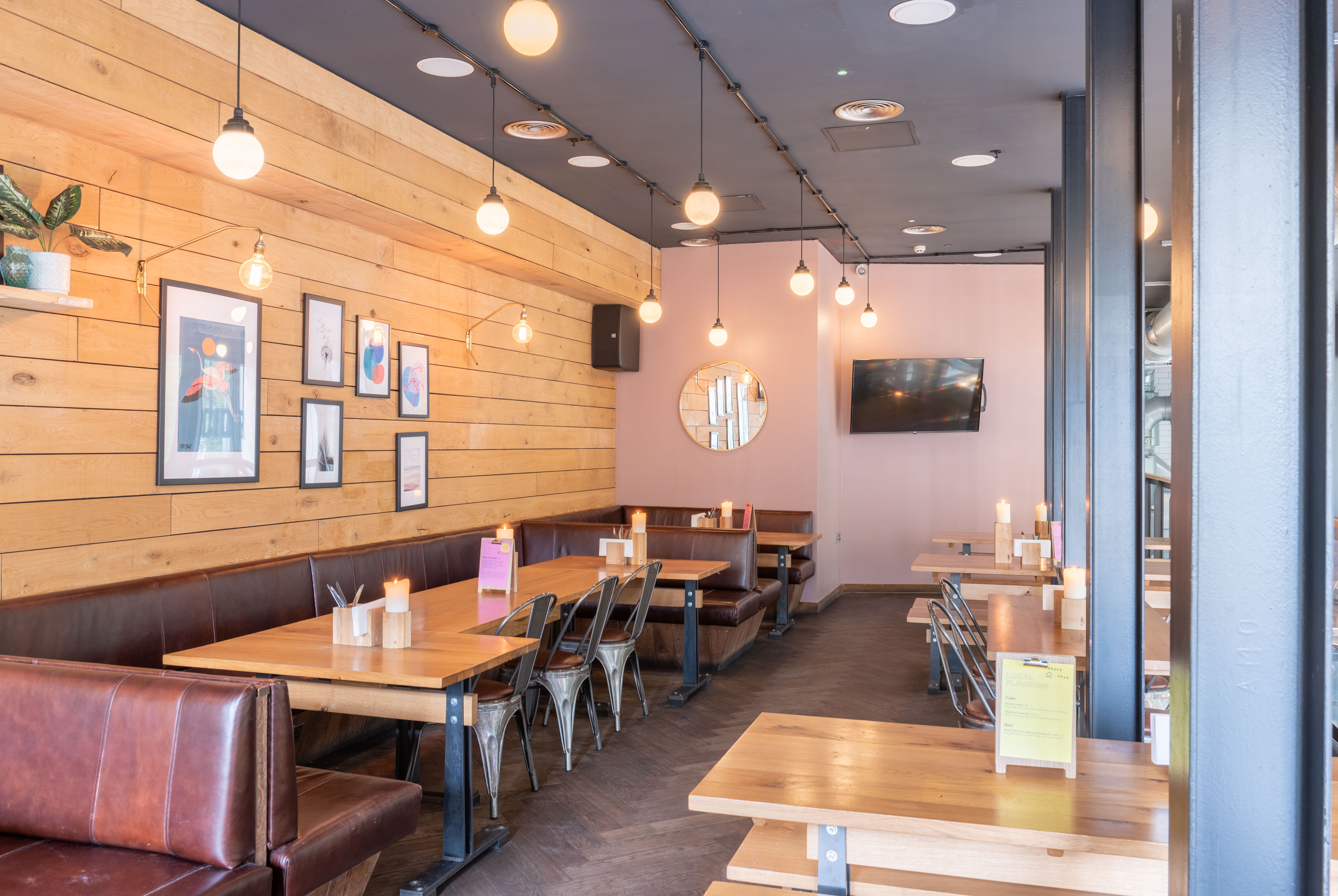 Modern venue with warm wood accents for casual meetings and events in Cardiff.